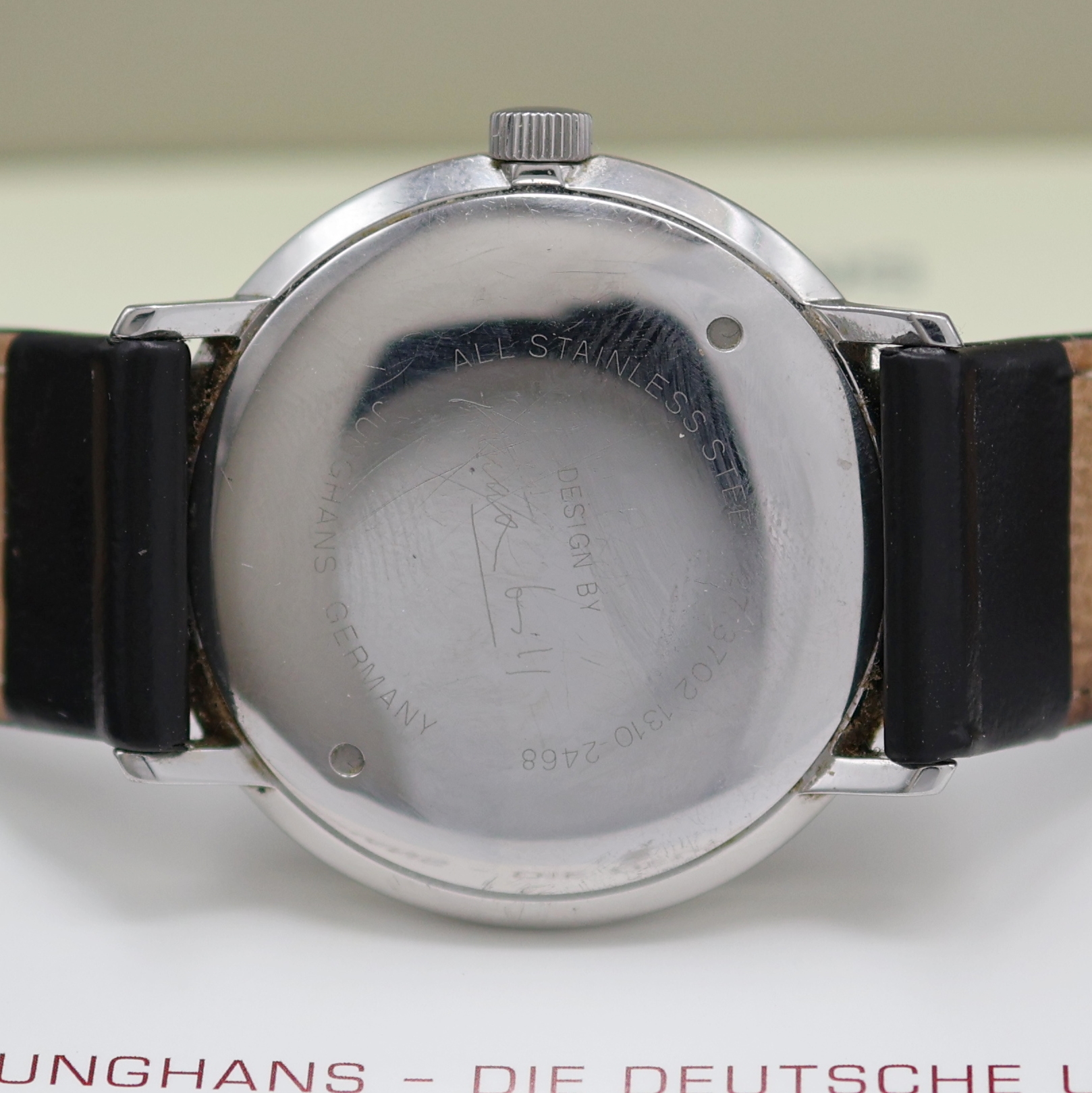 Detail d: JUNGHANS Armbanduhr Max Bill Referenz 27.3702, Deutschland um 2005, Handaufzug, Edelstahlgeh., Boden verschr., schwarzes Zifferbl. m. Leuchtzahlen, ...