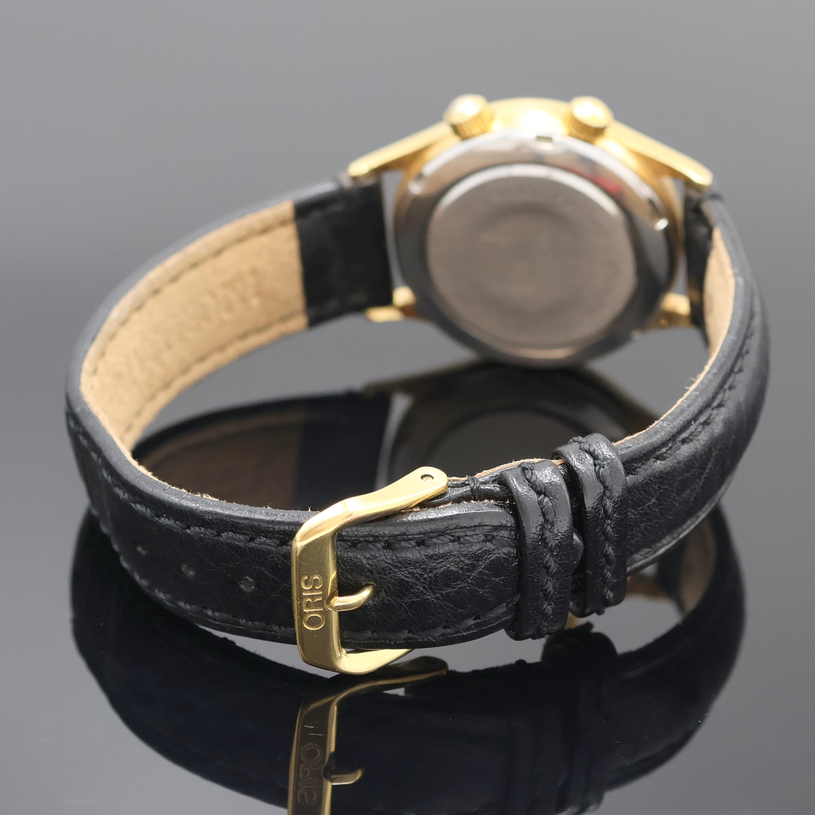Detail b: ORIS Armbandwecker Modell Wrist Alarm Referenz 420-7387, Schweiz um 1988, Handaufzug, verg. Metallgeh., Edelst.-Boden verschr., schwarzes ...