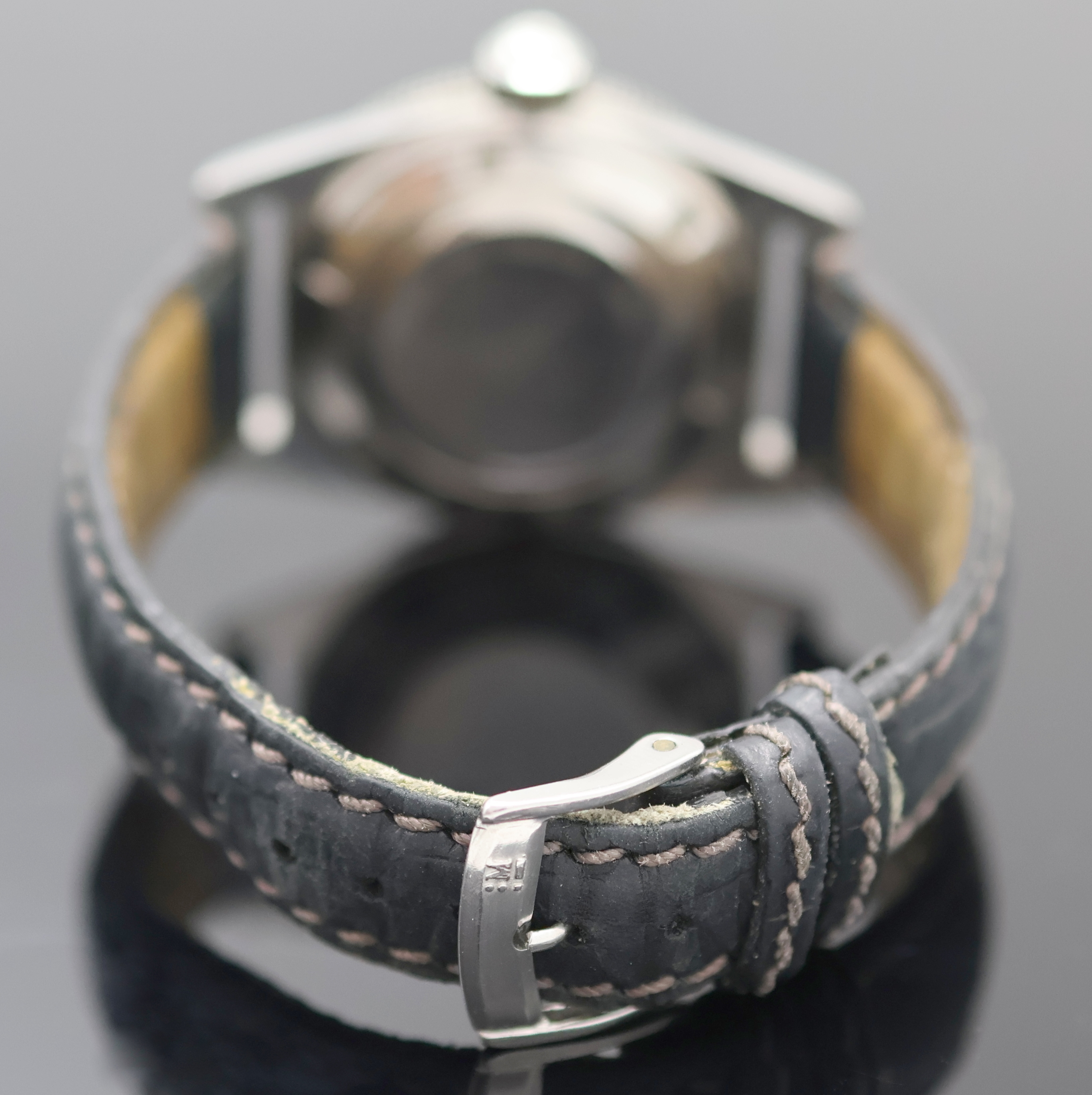 Detail b: TITUS Calypsomatic seltene Herrenarmbanduhr Referenz 7840, Automatik, Schweiz 1960er Jahre, Edelstahlgeh., Boden verschr., Bakelit-Lünette m. 60er ...