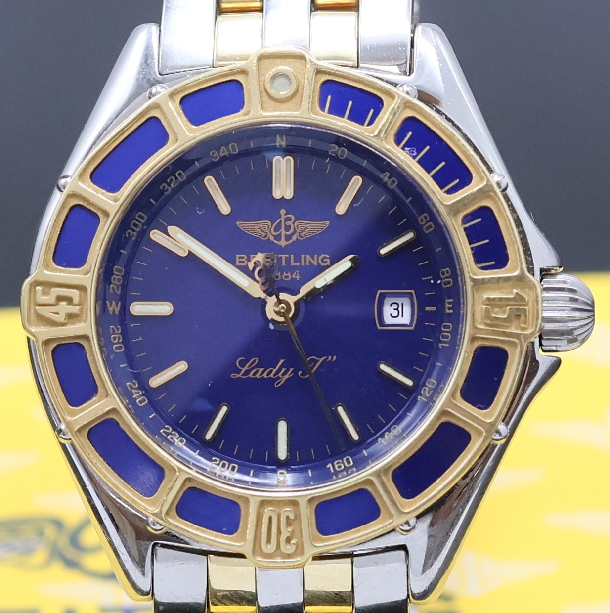 Detail a: BREITLING Damenarmbanduhr Lady J Referenz D52065, quarz, Edelstahl/Gold kombiniert inkl. Pilotband m. Faltschl., Boden und Krone verschr., ...