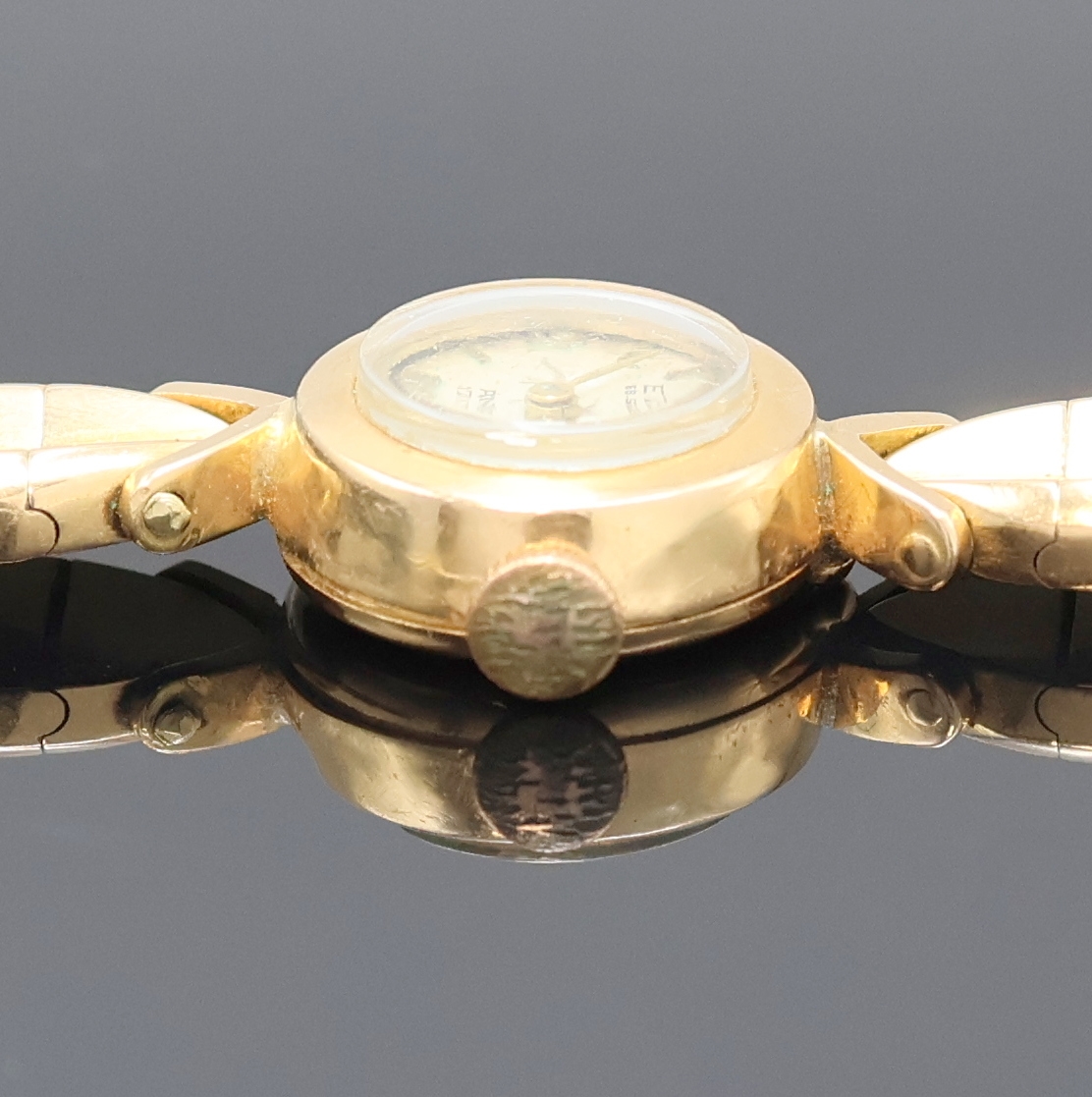 Detail b: ENVE Damenarmbanduhr in RG 750/000, Handaufzug, Schweiz um 1960, 2-teil. Geh. inkl. Gliederband im Verlauf, Boden aufgedr., silb. Zifferbl. m. ...