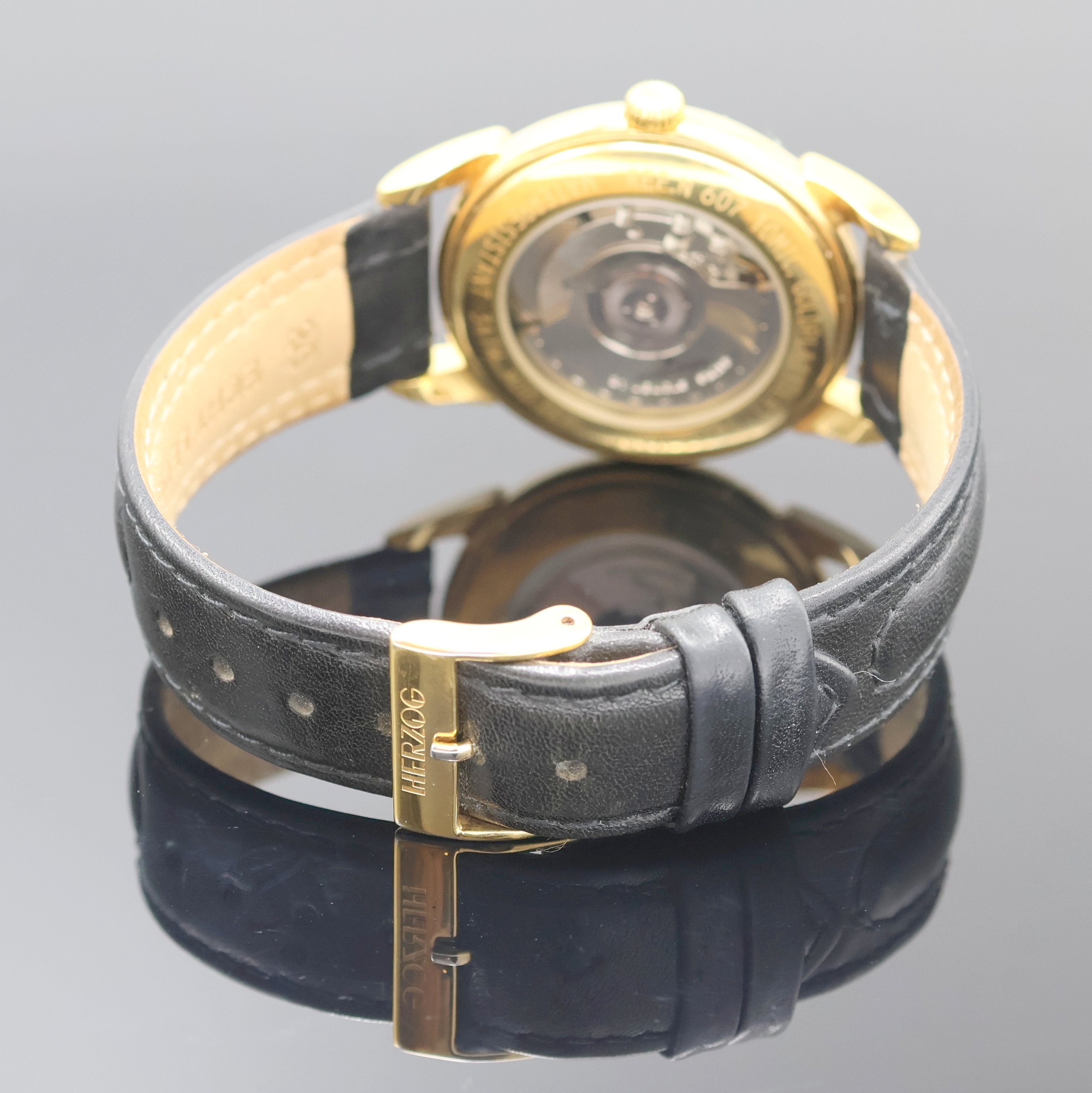 Detail b: JAQUES LEMANS Herrenarmbanduhr Worldtimer Referenz 607, Schweiz um 1995, Automatik, verg. Geh. beids. vergl., Boden aufgedr., silb. Zifferbl., im ...