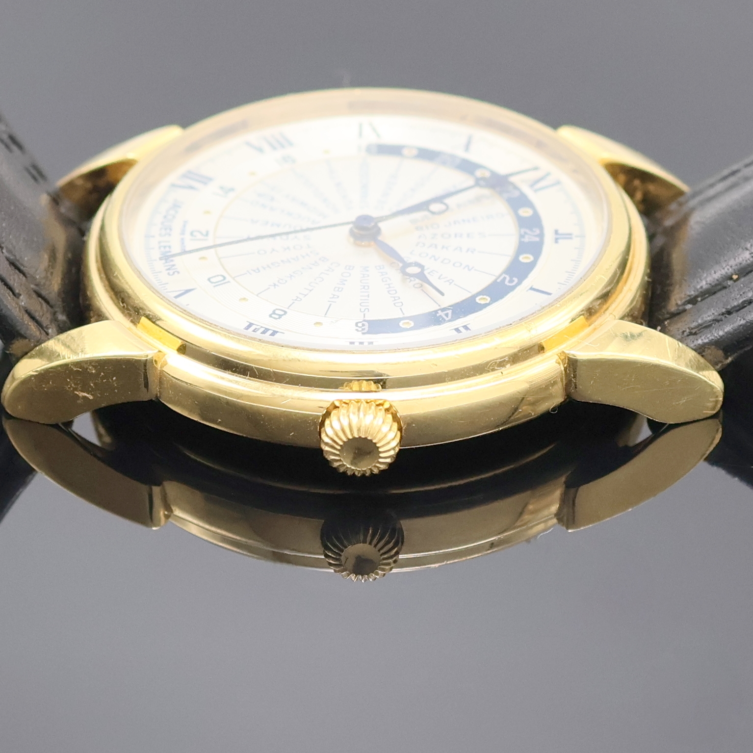 Detail c: JAQUES LEMANS Herrenarmbanduhr Worldtimer Referenz 607, Schweiz um 1995, Automatik, verg. Geh. beids. vergl., Boden aufgedr., silb. Zifferbl., im ...