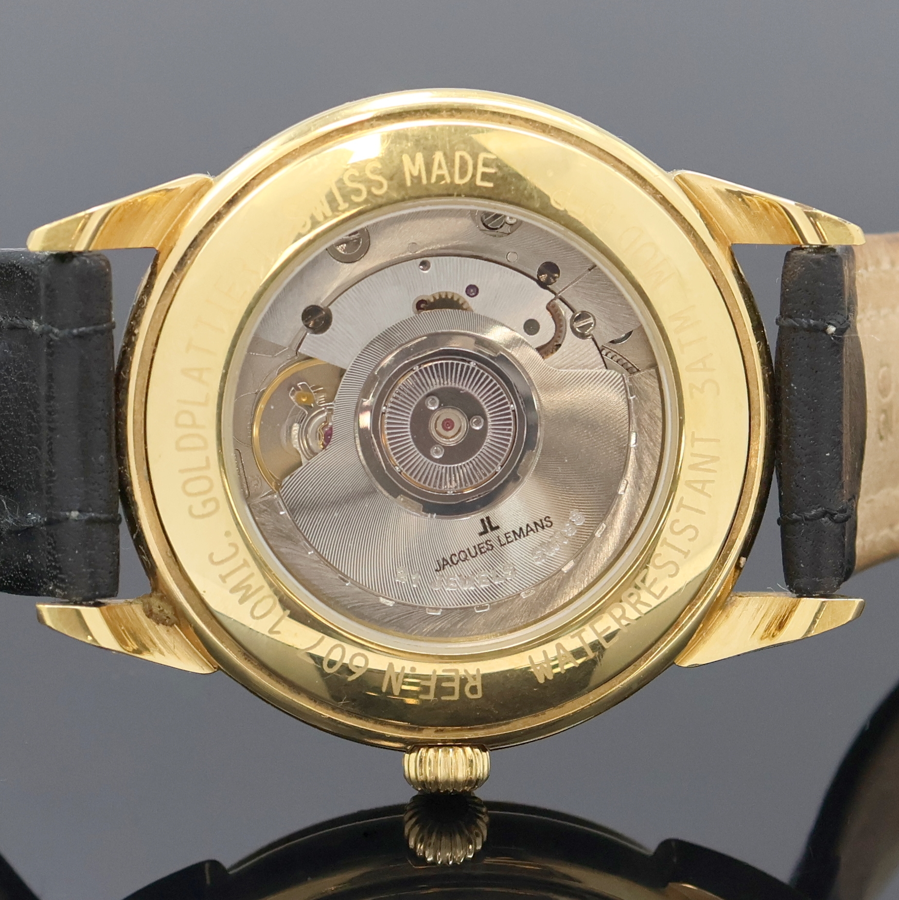 Detail e: JAQUES LEMANS Herrenarmbanduhr Worldtimer Referenz 607, Schweiz um 1995, Automatik, verg. Geh. beids. vergl., Boden aufgedr., silb. Zifferbl., im ...