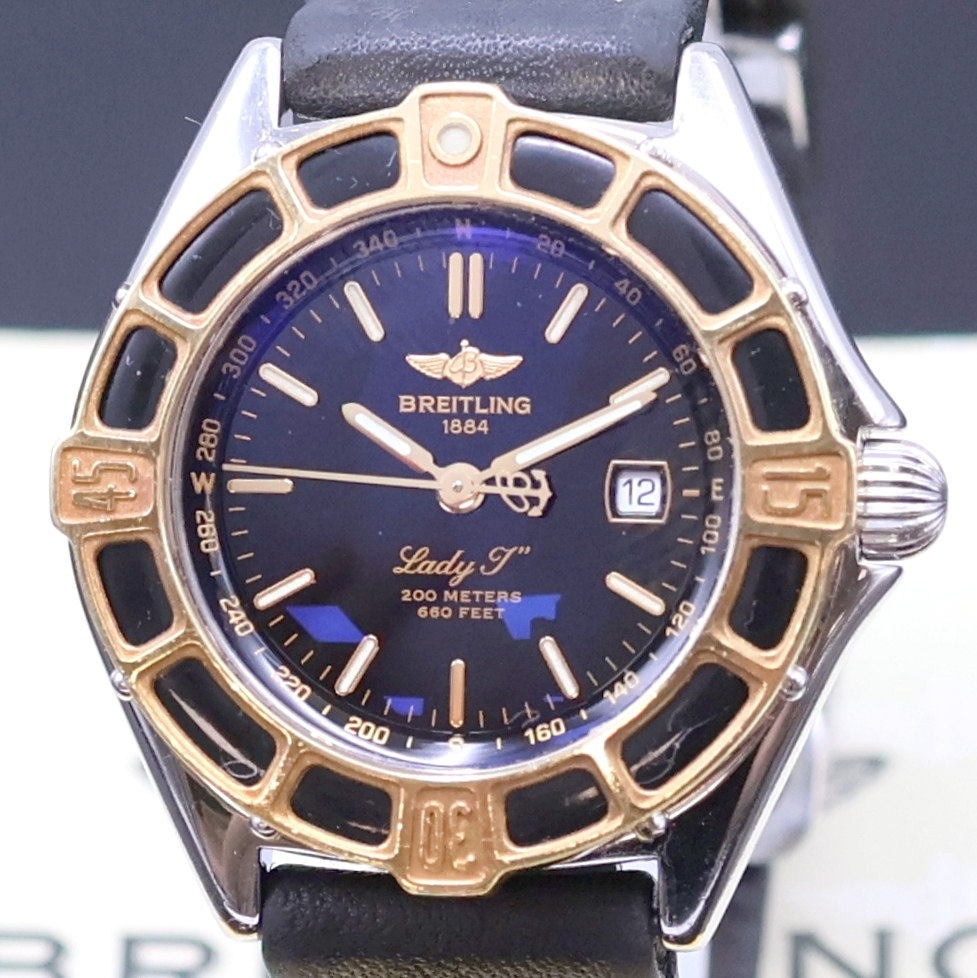 Detail a: BREITLING Lady J Damenarmbanduhr Referenz D52065, quarz, verschr. Edelstahlgeh., eins. rast. drehb. Gold-Lünette, Lederband m. orig. Faltschl., ...