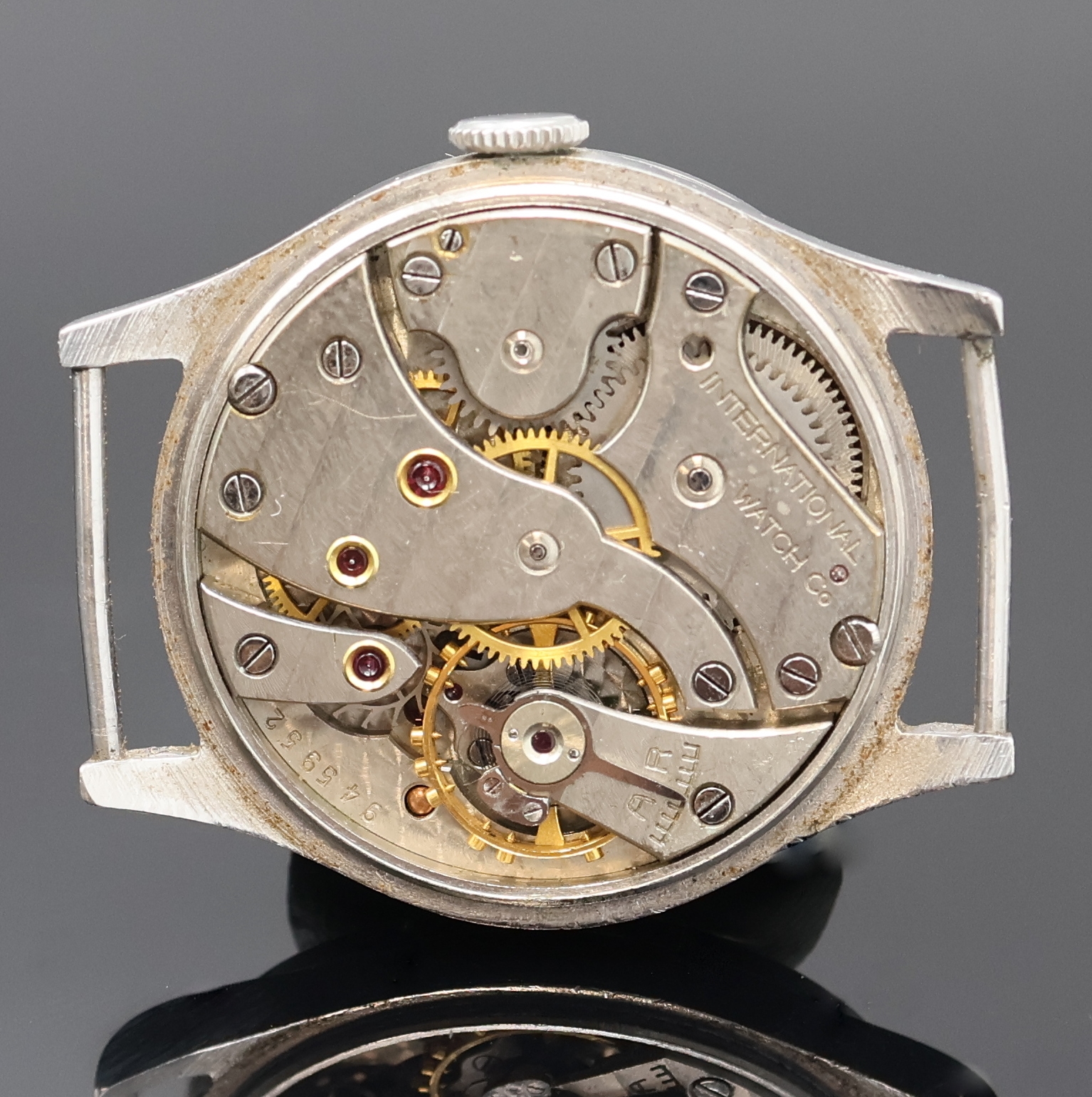 Detail c: IWC Armbanduhr in Stahl mit Kaliber 83 in seltener Ausführung, Schweiz um 1936, Handaufzug, 3 tlg.-Geh., Boden u. Glasrand aufgedr., silb. Zifferbl. ...