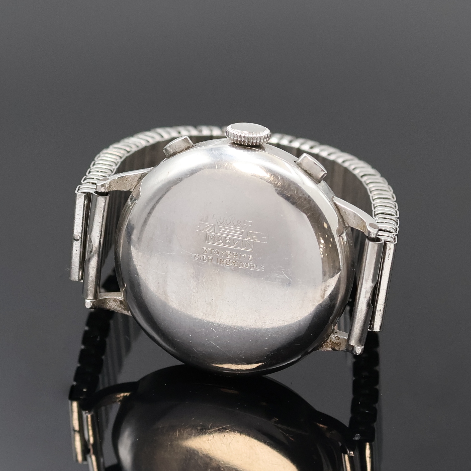 Detail c: MARVIN Schaltradchronograph in Stahl, Schweiz um 1940, Handaufzug, 3-teil. Geh., sign. Boden und Glasrand aufgedr., ovale Drücker, silb. orig. ...