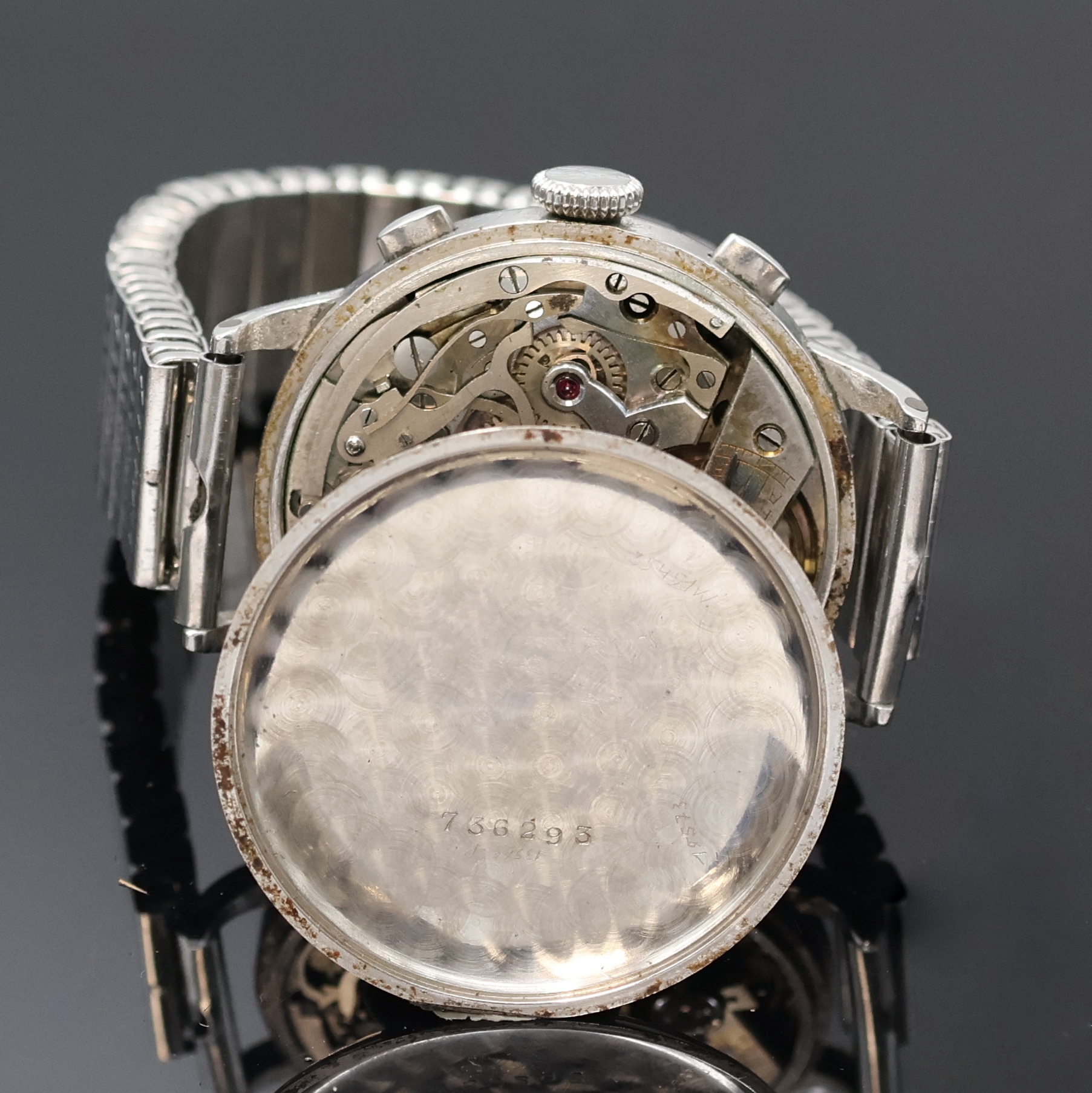 Detail e: MARVIN Schaltradchronograph in Stahl, Schweiz um 1940, Handaufzug, 3-teil. Geh., sign. Boden und Glasrand aufgedr., ovale Drücker, silb. orig. ...
