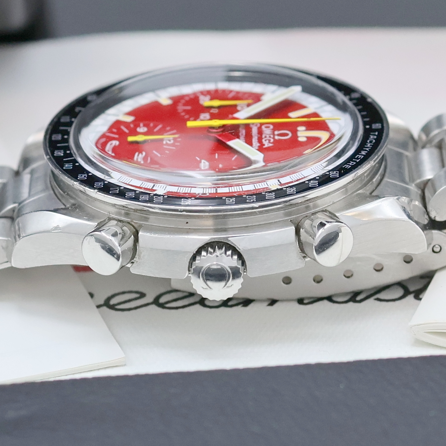 Detail d: OMEGA Herrenarmbanduhr Serie Speedmaster Sonderedition Michael Schumacher Referenz 3810.61, Automatik, Edelstahlgeh. inkl. orig. Gliederband m. ...