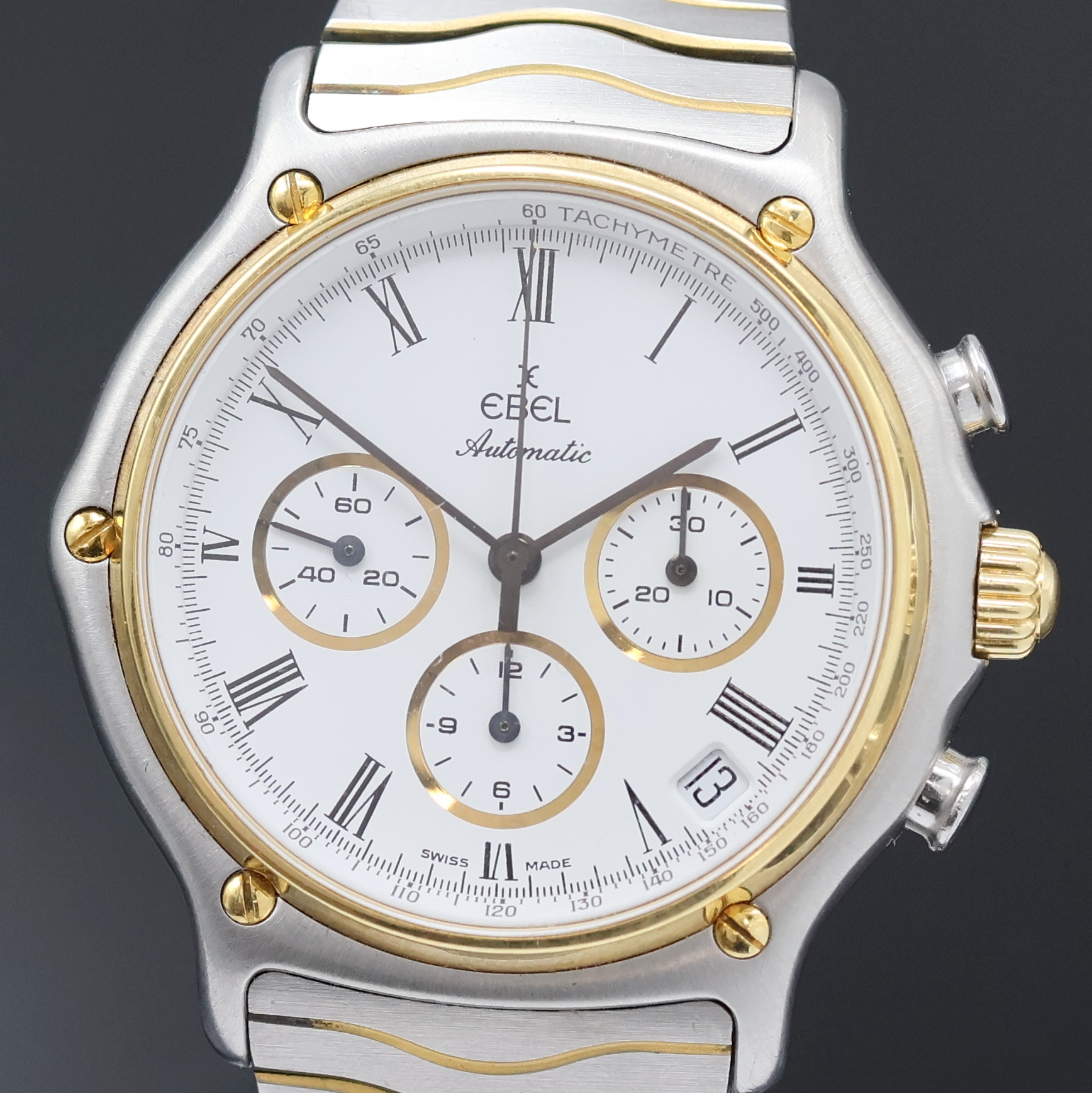 Detail a: EBEL Schaltradchronograph Referenz 1134901, Schweiz um 1990, Automatik, Edelstahl/Gold kombiniert inkl. Wellengliederband m. Kastenschl., Boden ...