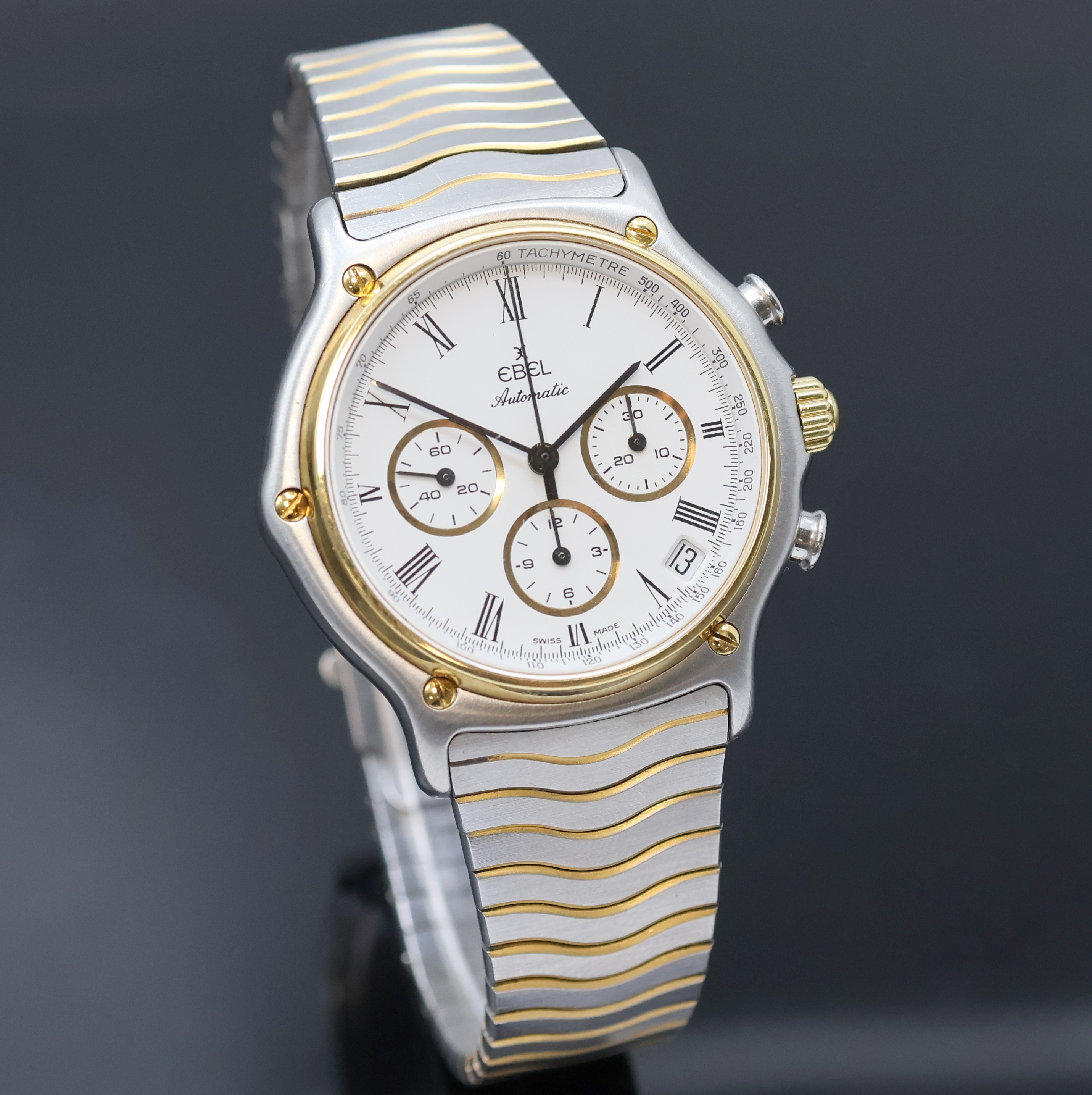 Detail b: EBEL Schaltradchronograph Referenz 1134901, Schweiz um 1990, Automatik, Edelstahl/Gold kombiniert inkl. Wellengliederband m. Kastenschl., Boden ...