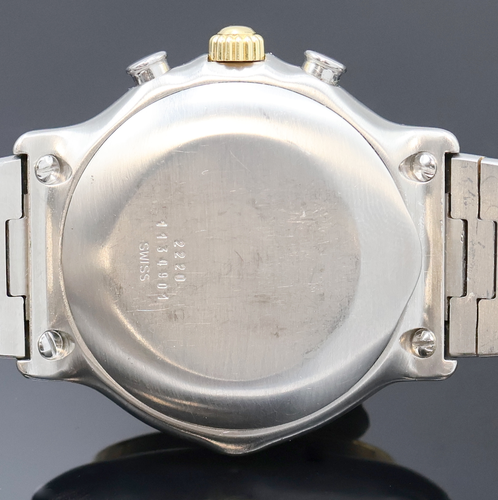 Detail e: EBEL Schaltradchronograph Referenz 1134901, Schweiz um 1990, Automatik, Edelstahl/Gold kombiniert inkl. Wellengliederband m. Kastenschl., Boden ...
