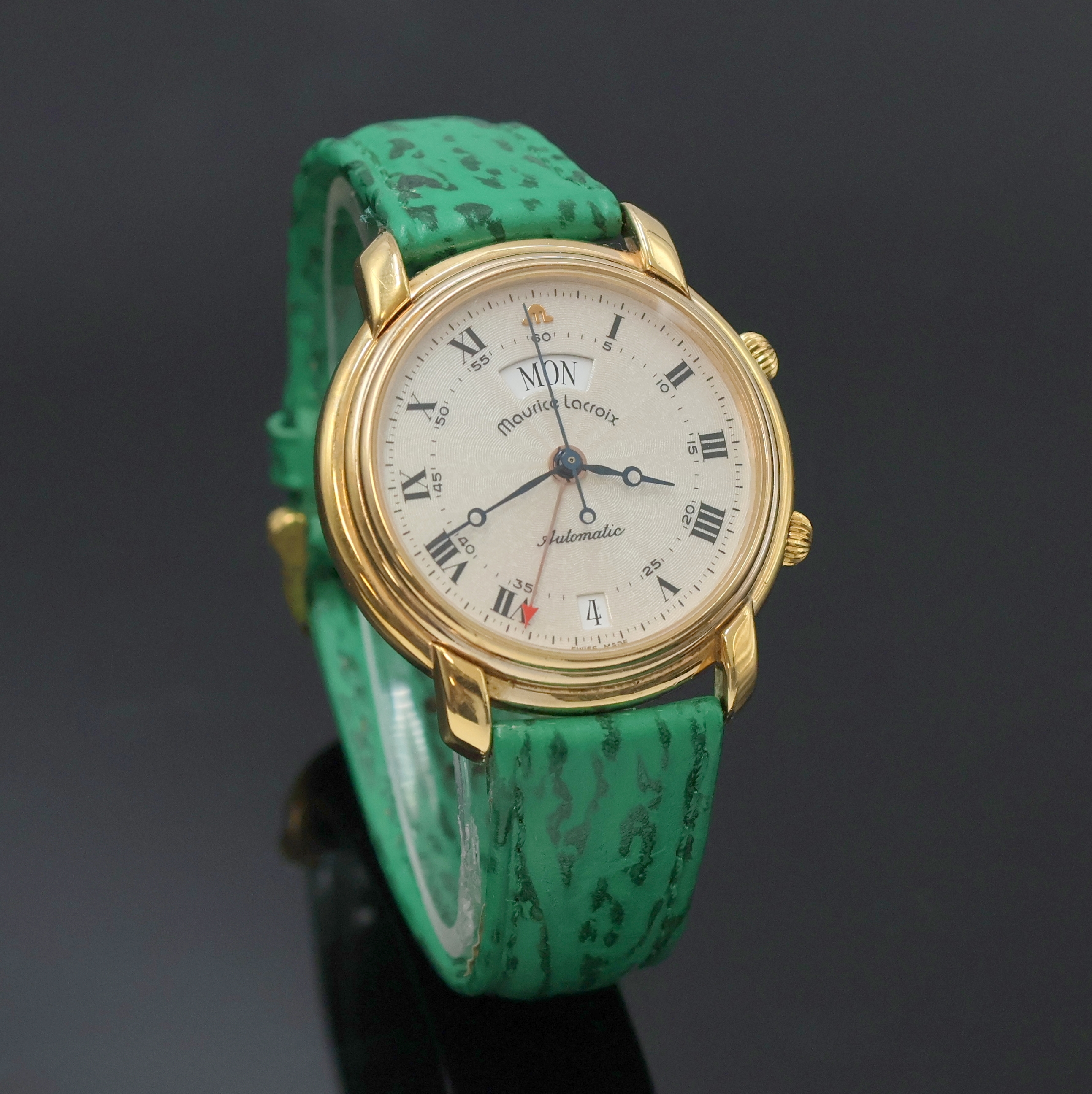 Detail b: MAURICE LACROIX Herrenarmbanduhr mit Wecker, Schweiz um 1995, Automatik, verg. Geh. beids. vergl., neutr. Lederband m. orig. verg. Dornschl., silb. ...