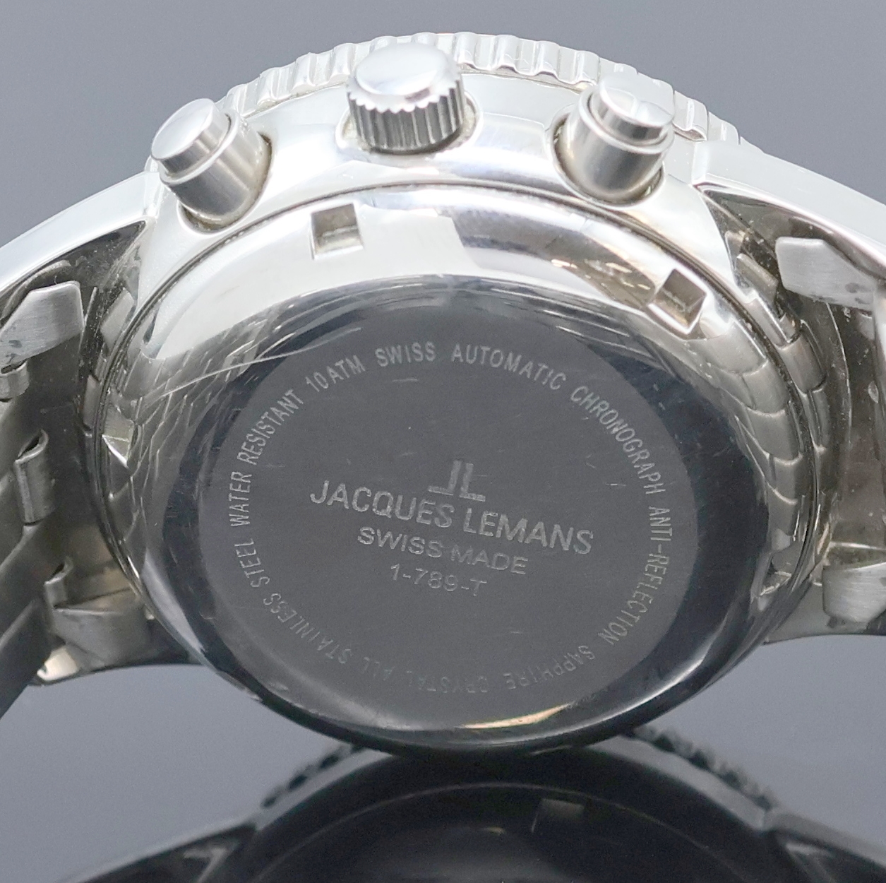 Detail e: JACQUES LEMANS Flieger-Armbandchronograph Referenz 1-789-T, Schweiz um 1995, Automatik, Edelstahlgeh. inkl. orig. Gliederband m. Faltschl., Boden u. ...