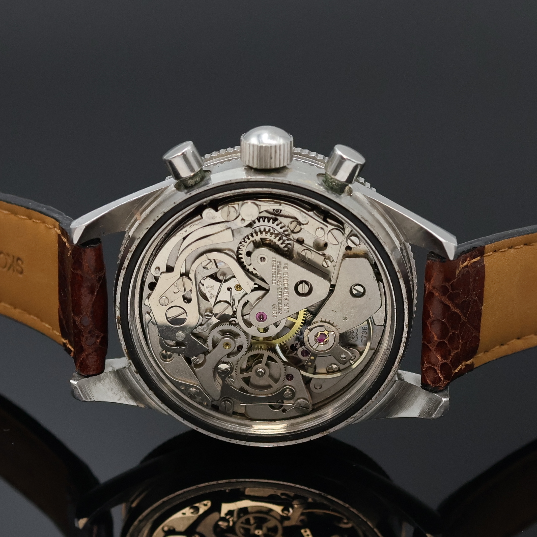 Detail d: LE JOUR Armbandchronograph in Stahl, Schweiz um 1970, Handaufzug, Boden verschr., Lünette m. 60er Teilung beids. drehb., schwarzes Zifferbl. m. ...