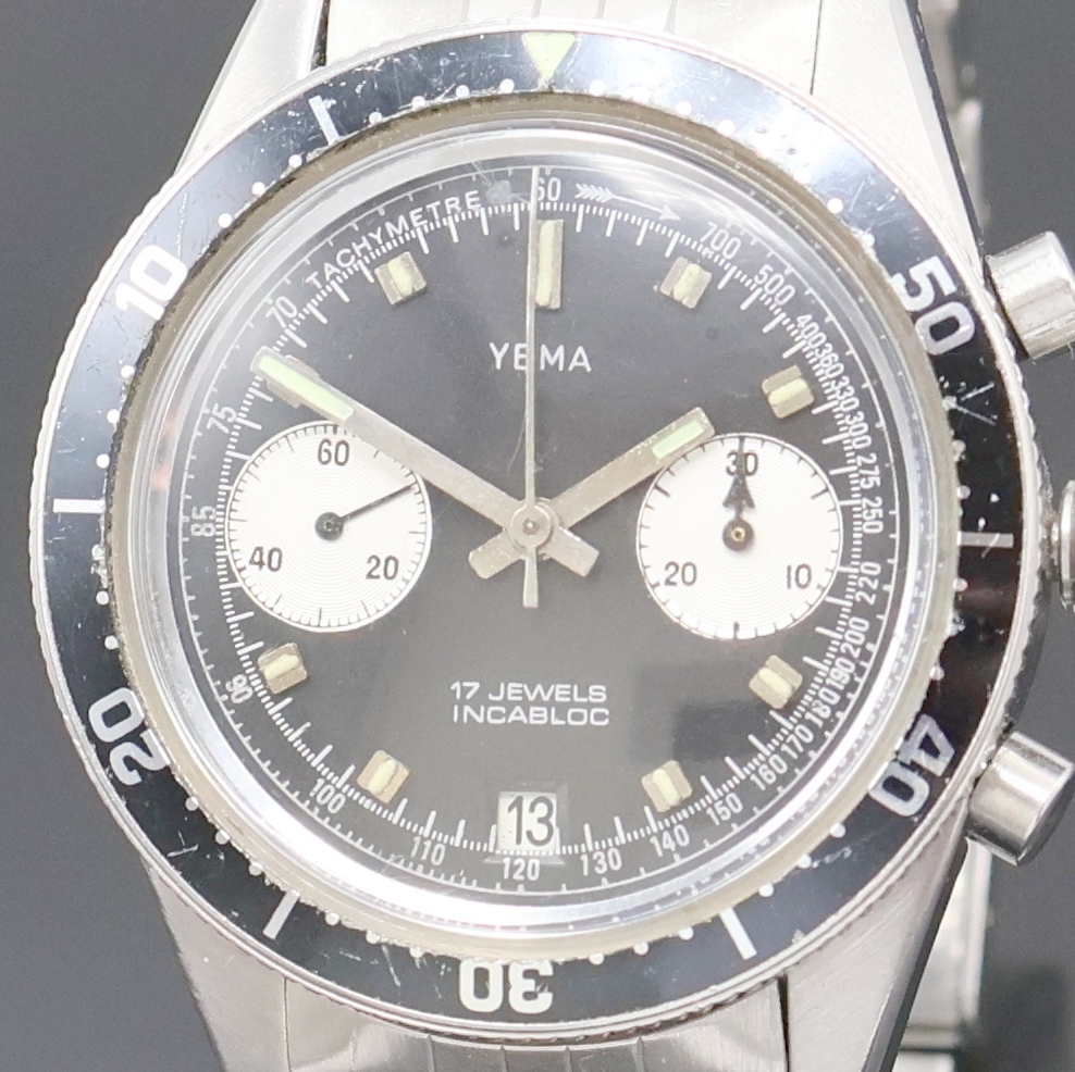 Detail a: YEMA Armbandchronograph in Stahl, Schweiz um 1970, Handaufzug, Boden verschr., neutr. Gliederband m. Faltschl., Lünette m. 60er Teil. beids. drehb., ...