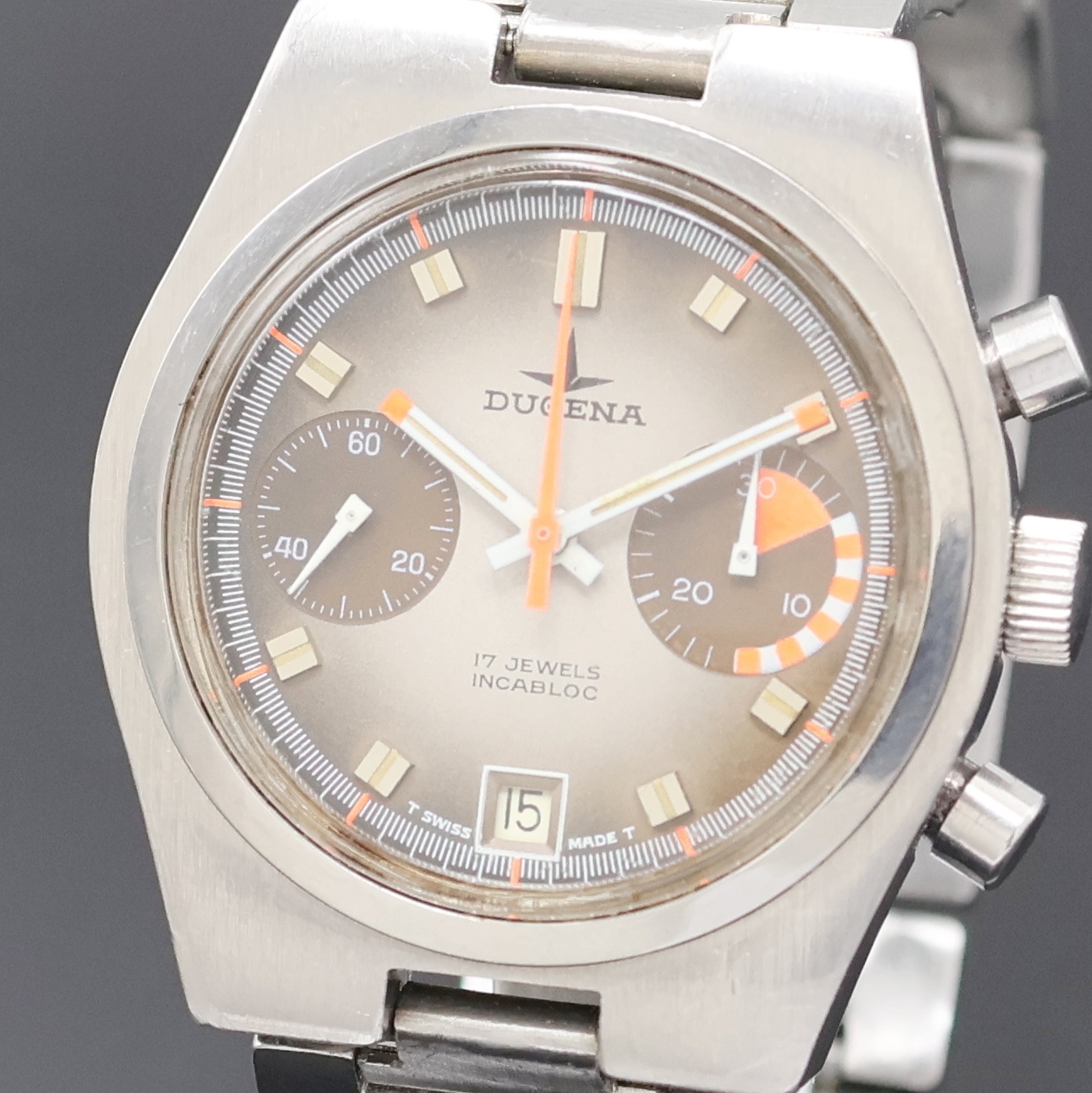 Detail a: DUGENA Armbandchronograph Referenz 157, Schweiz um 1970, Handaufzug, Edelstahlgeh. inkl. Stahlband, Boden m. Widmung verschr., Fume-Zifferbl. m. ...
