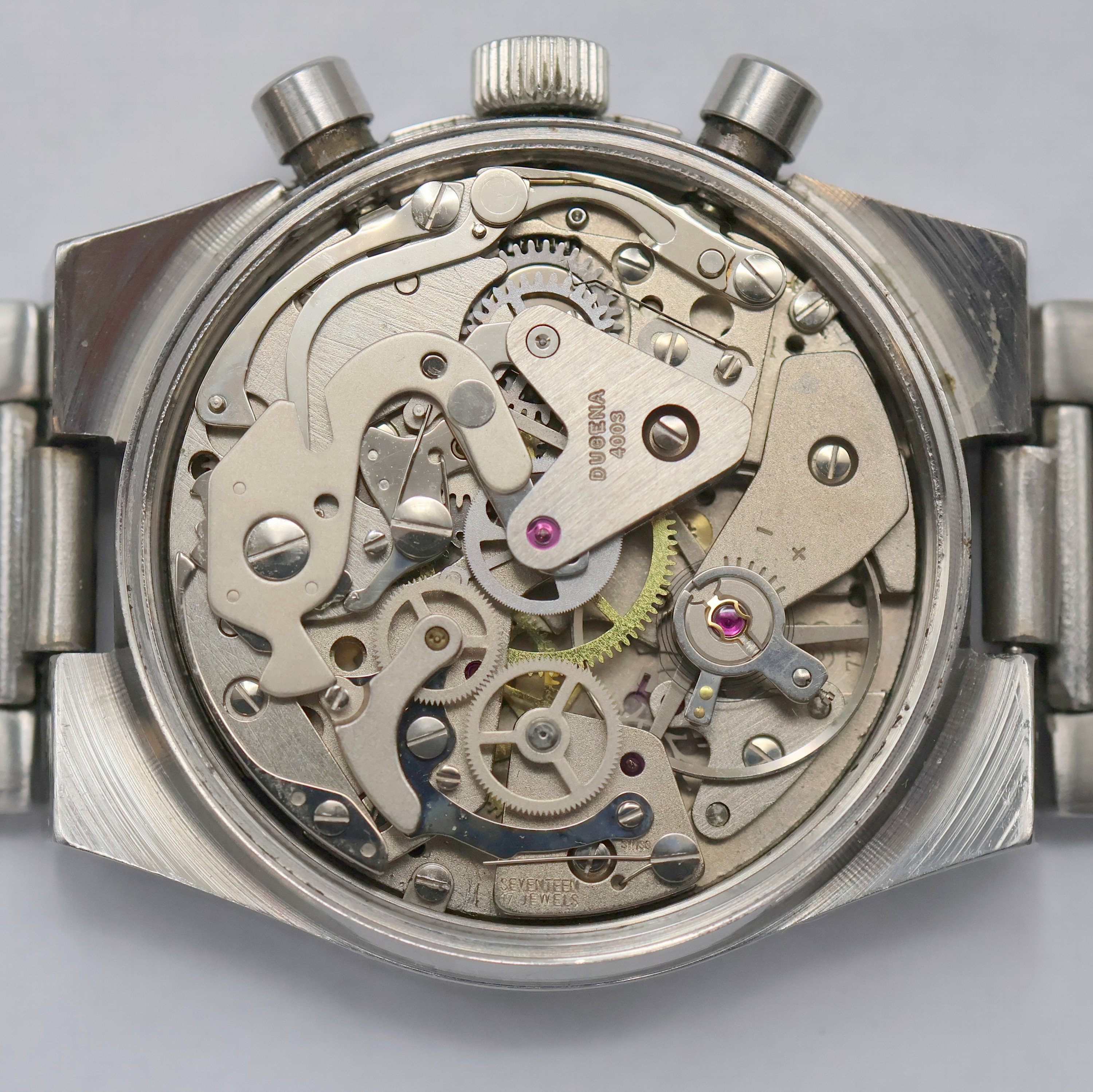 Detail f: DUGENA Armbandchronograph Referenz 157, Schweiz um 1970, Handaufzug, Edelstahlgeh. inkl. Stahlband, Boden m. Widmung verschr., Fume-Zifferbl. m. ...