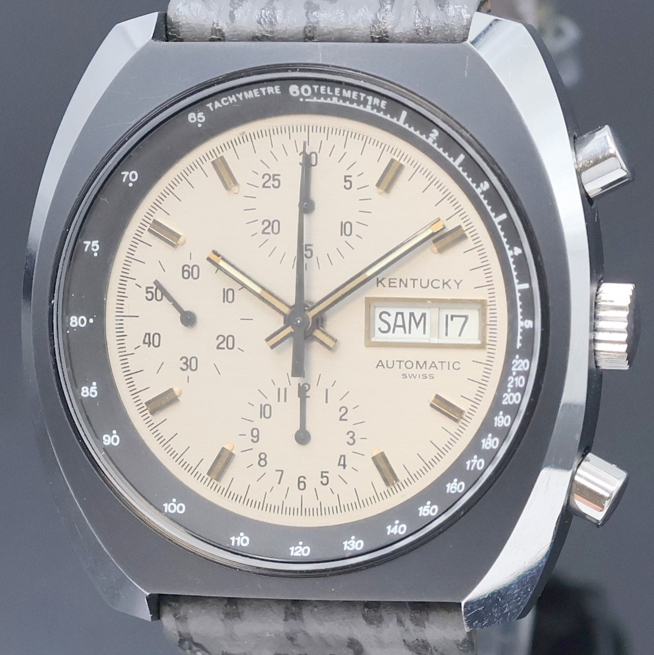 Detail a: Armbandchronograph bezeichnet Kentucky, Schweiz um 1975, Automatik, Edelstahlgeh. teils geschw., Boden verschr., silb. Zifferbl. m. aufges. ...