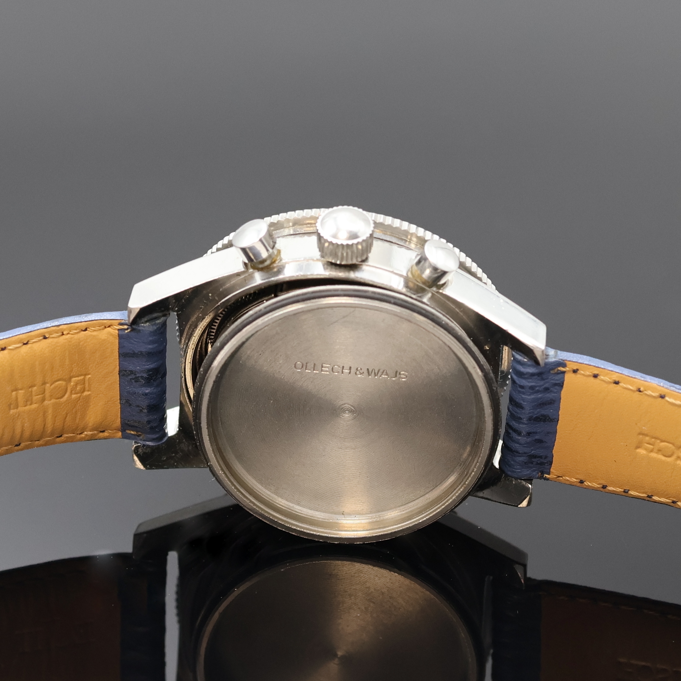 Detail e: JENNY/OLLECH & WAJS Precision Armbandchronograph, Schweiz um 1970, Handaufzug, Edelstahlgeh., Boden u. Krone verschr., Bakelitt-Lünette beids. ...