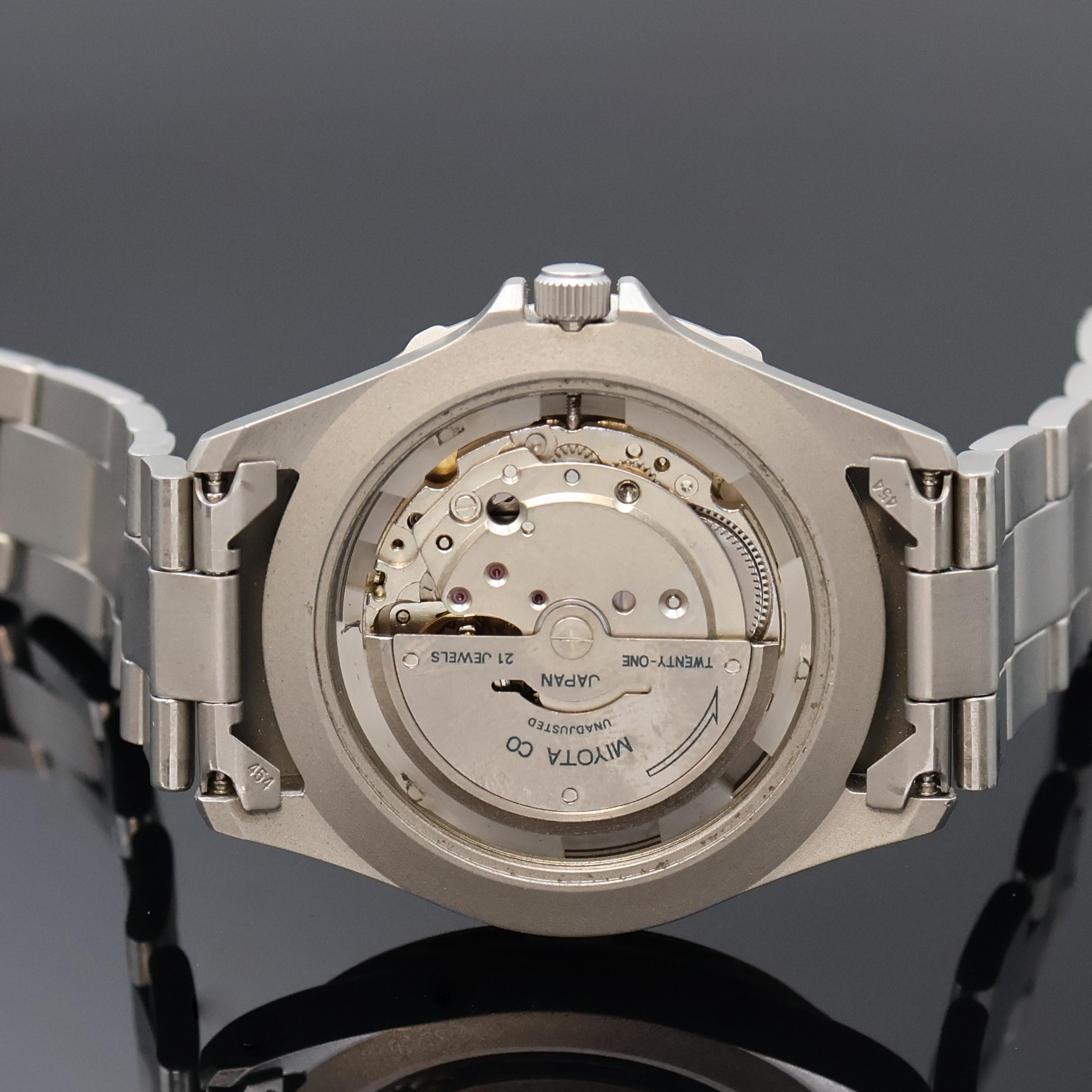 Detail e: DUGENA Poseidon Armbanduhr in Stahl, Schweiz 1980er Jahre, Automatik, Boden u. Krone verschr., orig. Gliederband m. Faltschl., Tauchverlängerung, ...