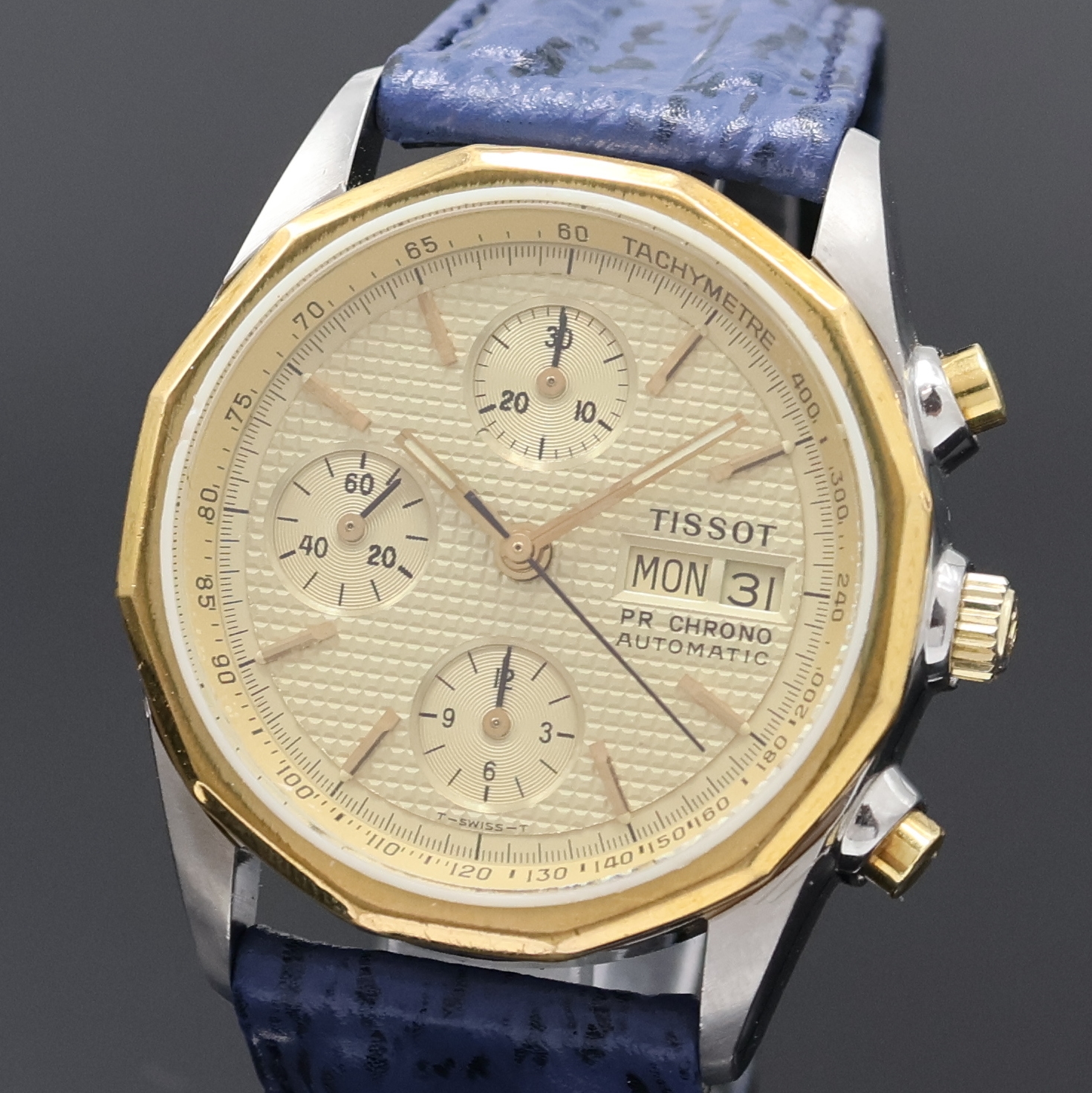 Detail a: TISSOT PR 100 Armbandchronograph in Stahl, Schweiz 1980er Jahre, Automatik, Boden u. Krone verschr., goldfarb. Zifferbl. m. aufges. Std.-Ind., ...