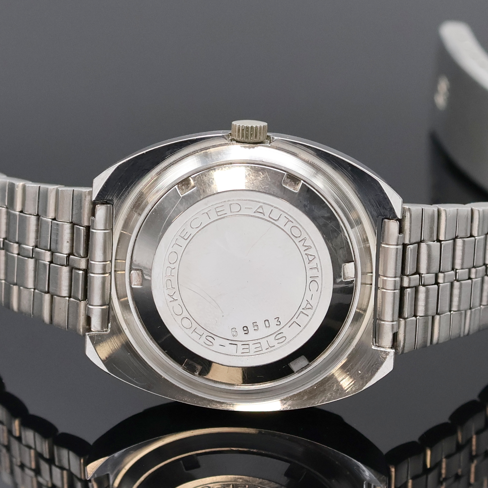 Detail c: ARSA-MATIC Precision Herrenarmbanduhr in Stahl, Schweiz um 1970, Automatik, Boden verschr., neutr. Stahlband m. Faltschl., silb. Zifferbl. m. aufges. ...