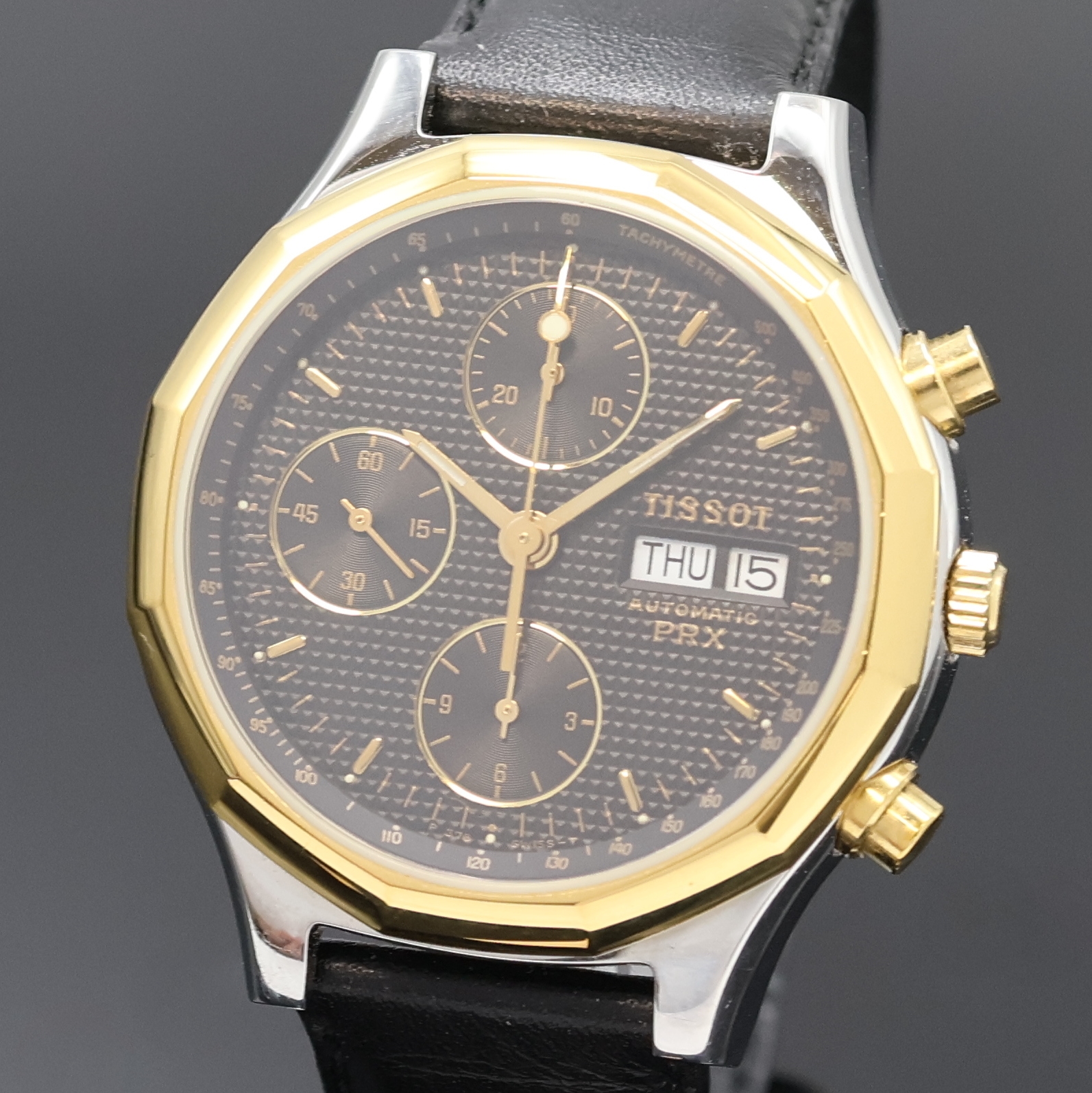 Detail a: TISSOT PRX Armbandchronograph, Schweiz um 1990, Automatik, Stahlgeh. m. verg. 12-eckiger Lünette, Boden verschr., schwarz. Waffel- Zifferbl., gold. ...