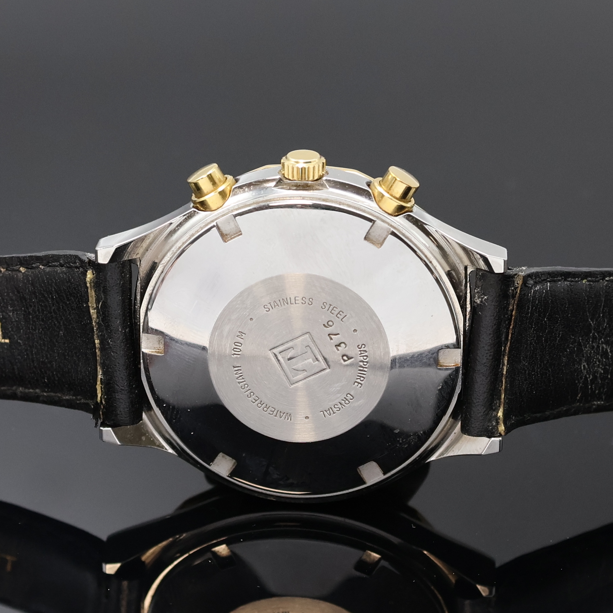 Detail d: TISSOT PRX Armbandchronograph, Schweiz um 1990, Automatik, Stahlgeh. m. verg. 12-eckiger Lünette, Boden verschr., schwarz. Waffel- Zifferbl., gold. ...