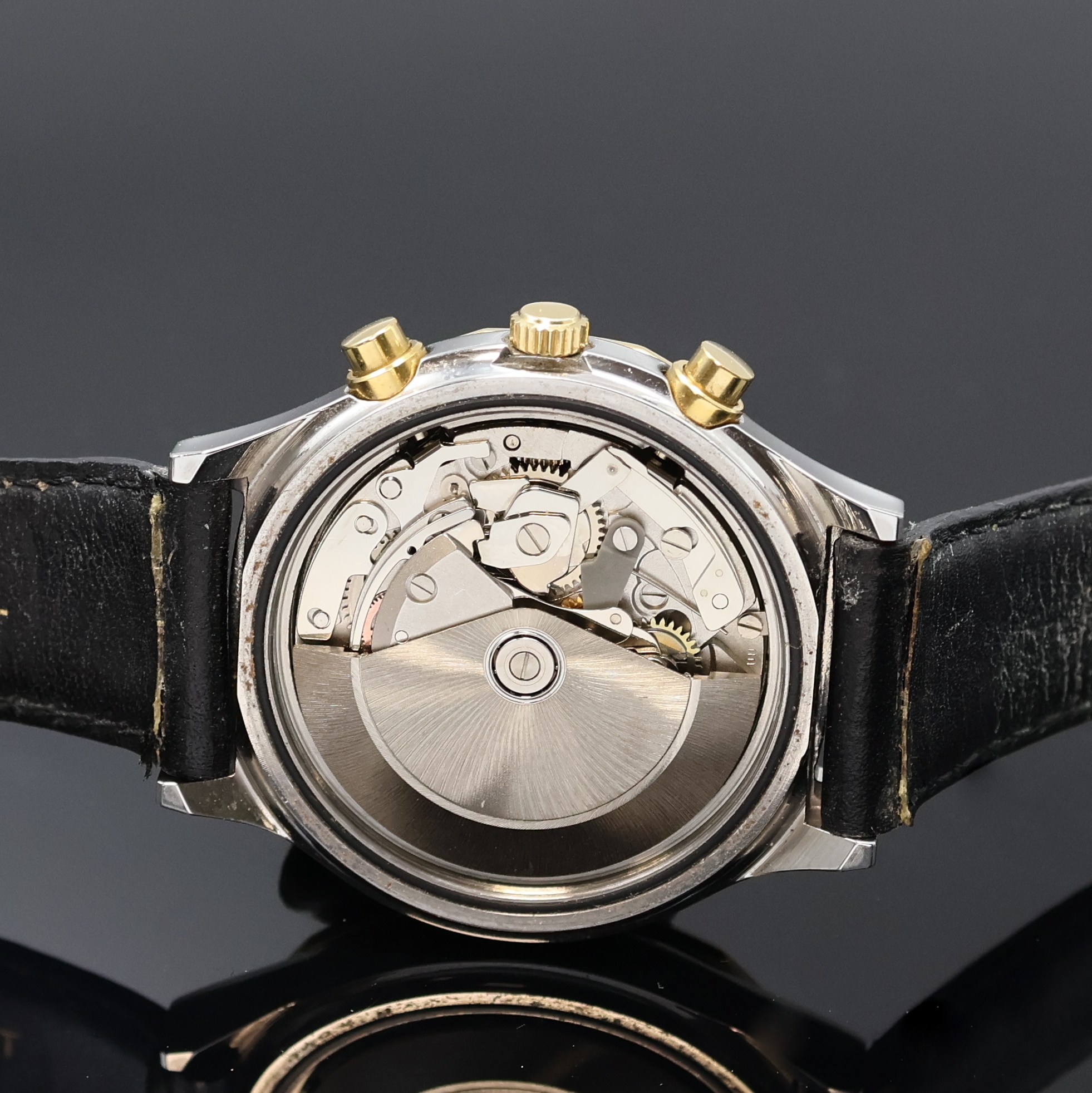 Detail e: TISSOT PRX Armbandchronograph, Schweiz um 1990, Automatik, Stahlgeh. m. verg. 12-eckiger Lünette, Boden verschr., schwarz. Waffel- Zifferbl., gold. ...