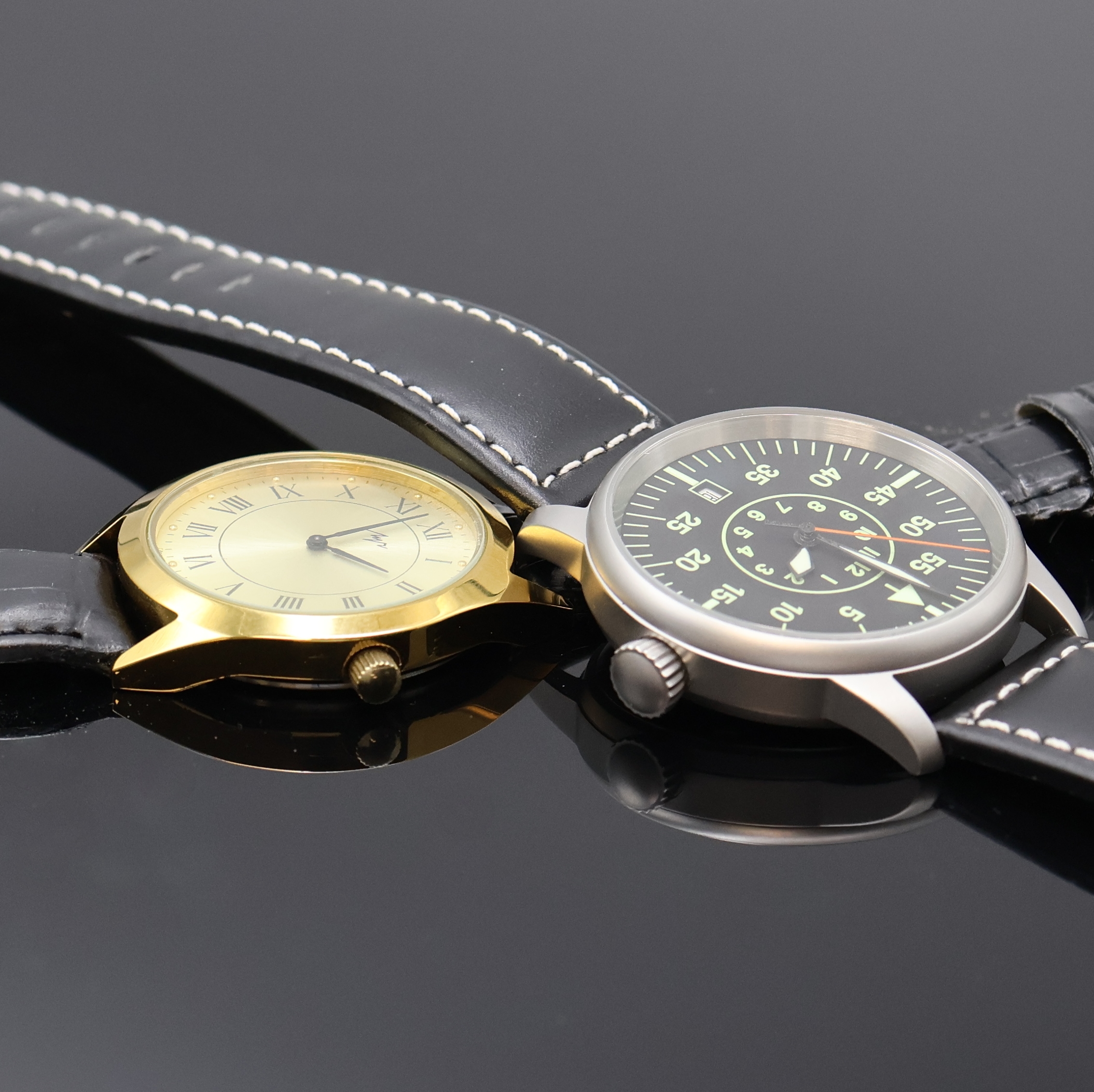 Detail c: 6 Russische Armbanduhren, Russland um 1980- 2010, Handaufzug/Automatik, 4 Chronographen, 2 Armbanduhren, Stahl/vergoldete Geh., Böden verschr. u. ...