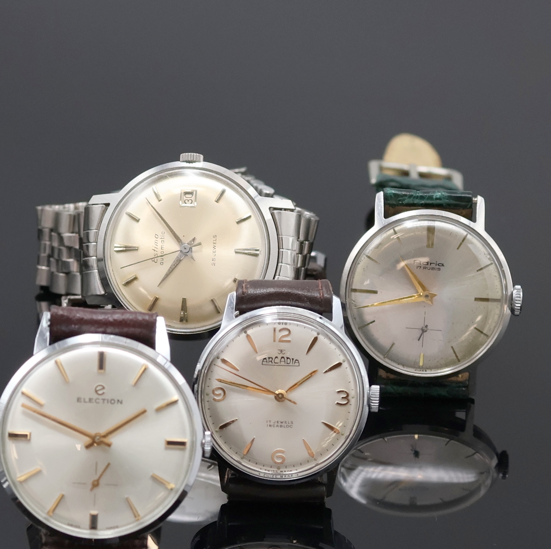 Detail b: ADRIA, ELECTION, DULFI, ESTIMA und ARCADIA 5 Armbanduhren, Schweiz um 1960, Handaufzug/Automatik, verchr./Edelstahlgeh., Böden verschr. u. gedr., ...