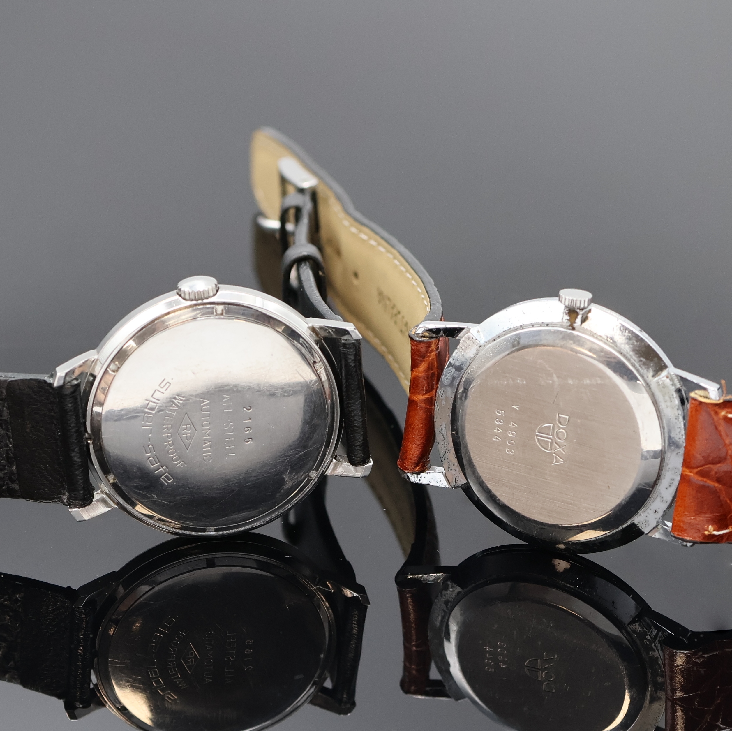 Detail d: ROYCE, BERGANA, ROYAL, DOXA und ERNEST BOREL 5 Armbanduhren, Schweiz um 1960-2000, Handaufzug u. Automatik, verchr./Stahl u. Titan, Böden verschr. ...