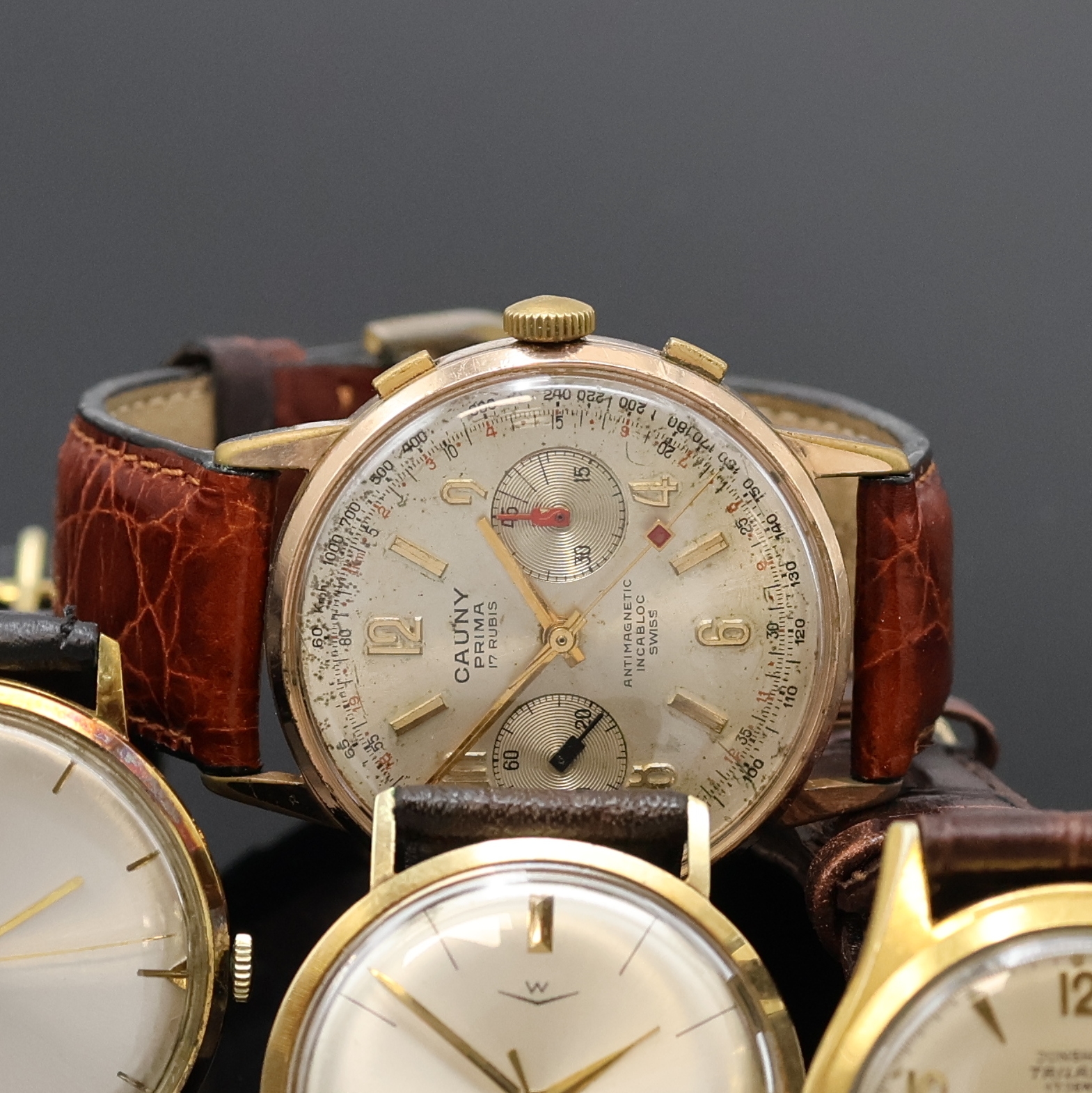 Detail b: JUNGHANS, CAUNY Chronograph sowie 2 weitere Armbanduhren bezeichnet W, Schweiz 1950er/60er Jahre, Handaufzug, 3x verg. Gehäuse, 1x GG 585/000, ...
