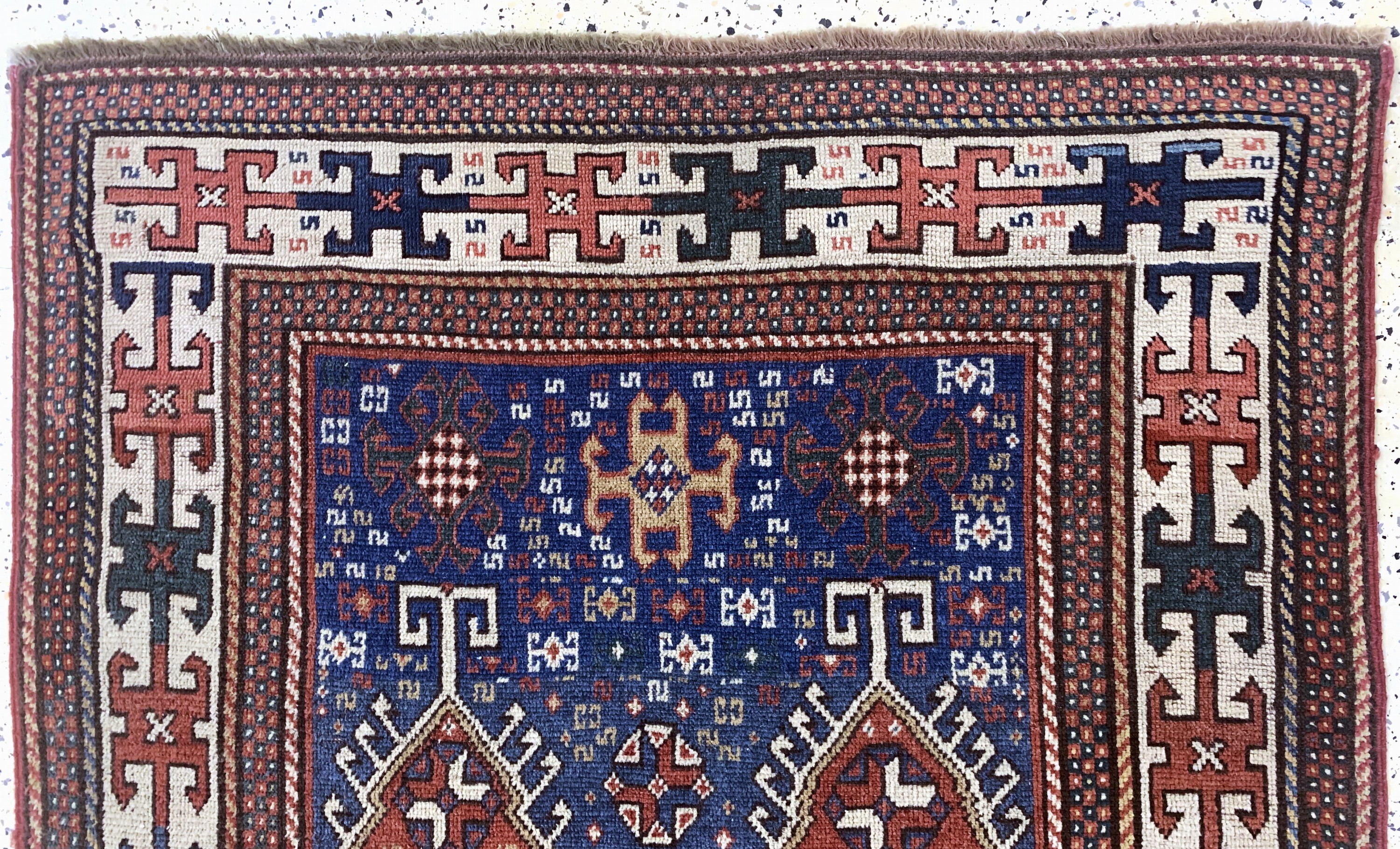 Detail a: Antiker Kazak, Kaukasus, 19.Jhd, Wolle auf Wolle, ca. 220 x 120 cm, EHZ:(gleichmäßig dünn), restauriert