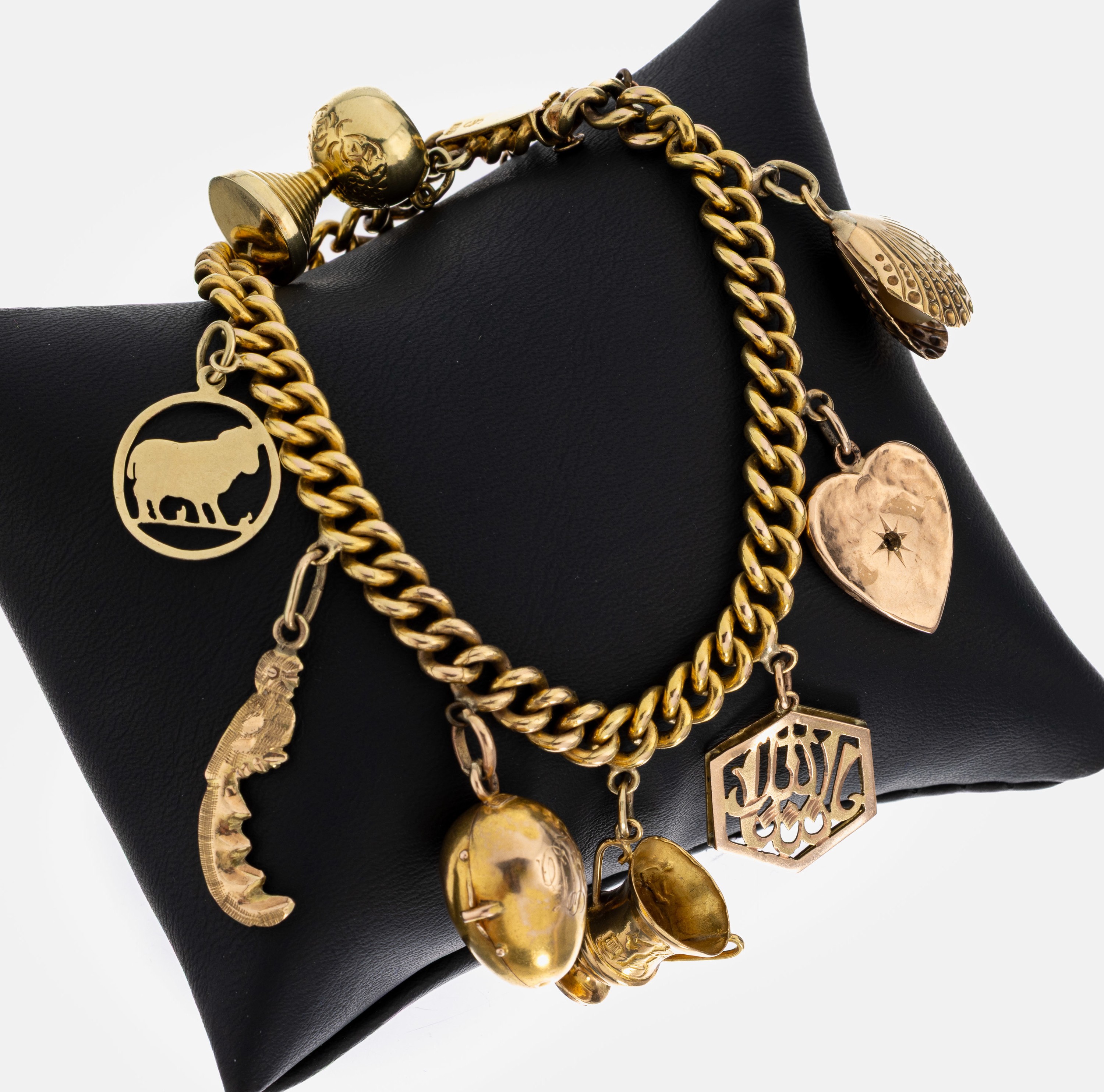 Image 27007040 - 14 kt Gold Armband mit 9 Anhängern, GG 585/000 gepr., Abhängungen: Muschel mit Perle, ...