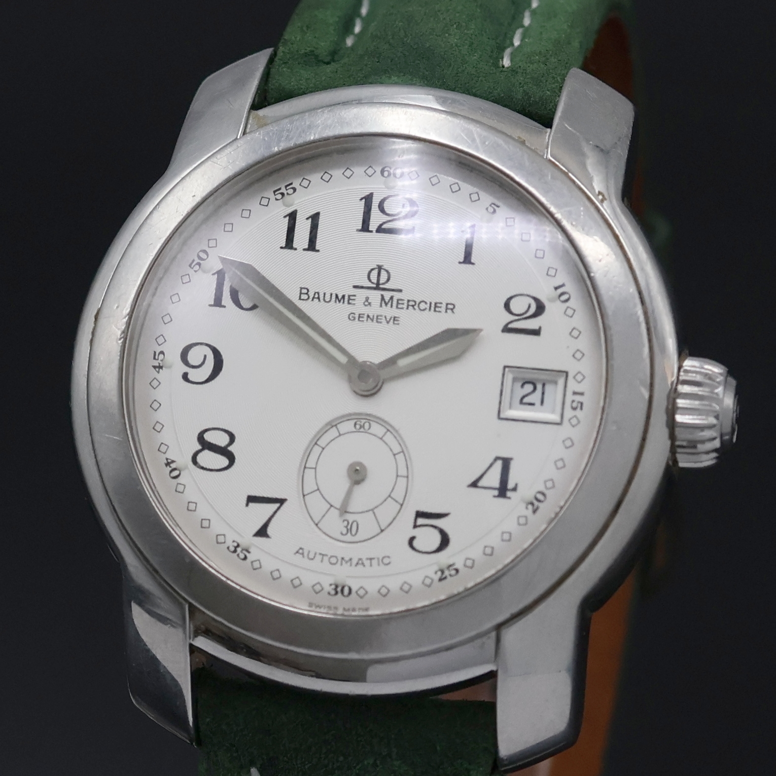 Detail a: BAUME & MERCIER Capeland Herrenarmbanduhr Referenz MV045221, Schweiz um 2005, Automatik, Edelstahlgeh., Boden u. Krone verschr., silb. Zifferbl. m. ...