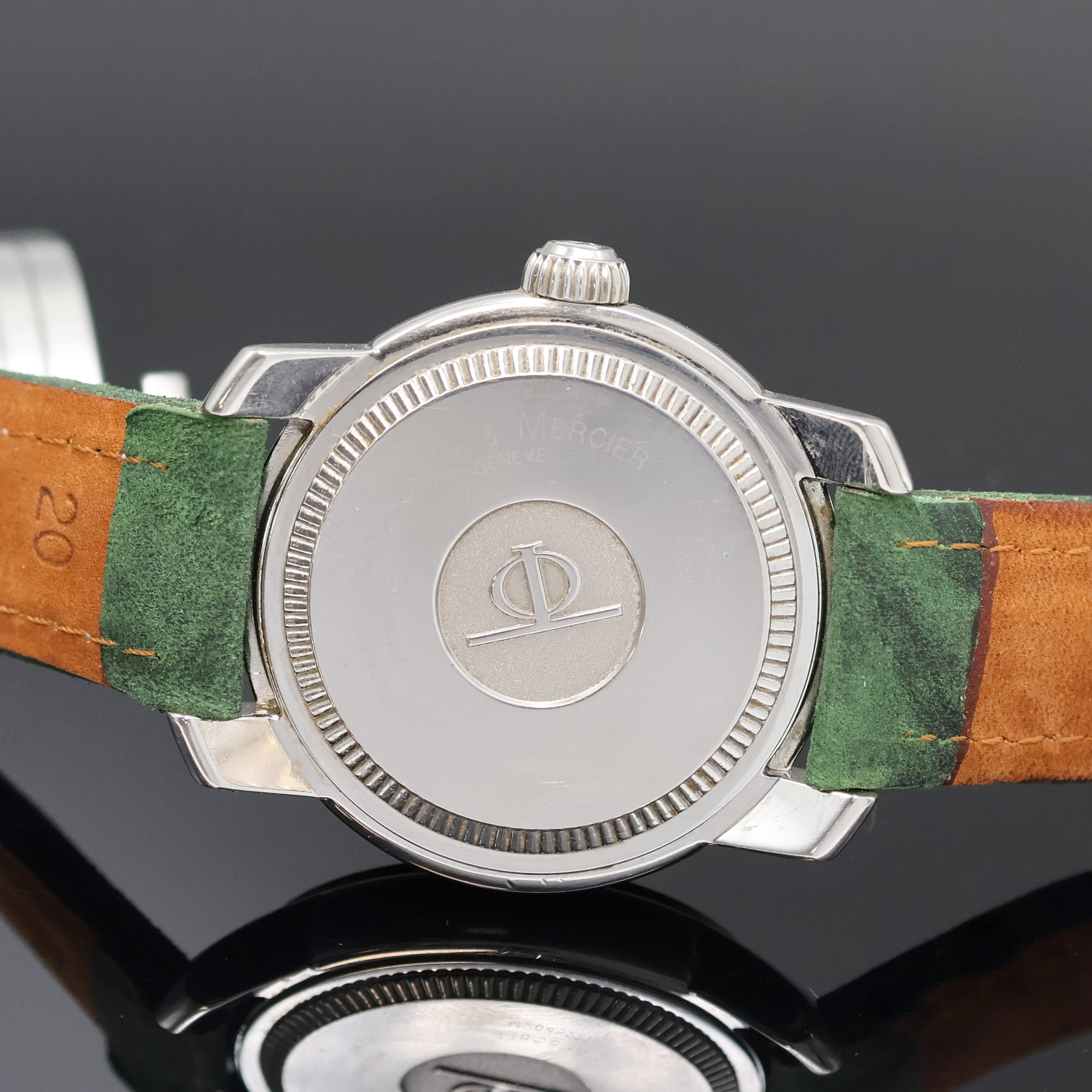 Detail e: BAUME & MERCIER Capeland Herrenarmbanduhr Referenz MV045221, Schweiz um 2005, Automatik, Edelstahlgeh., Boden u. Krone verschr., silb. Zifferbl. m. ...