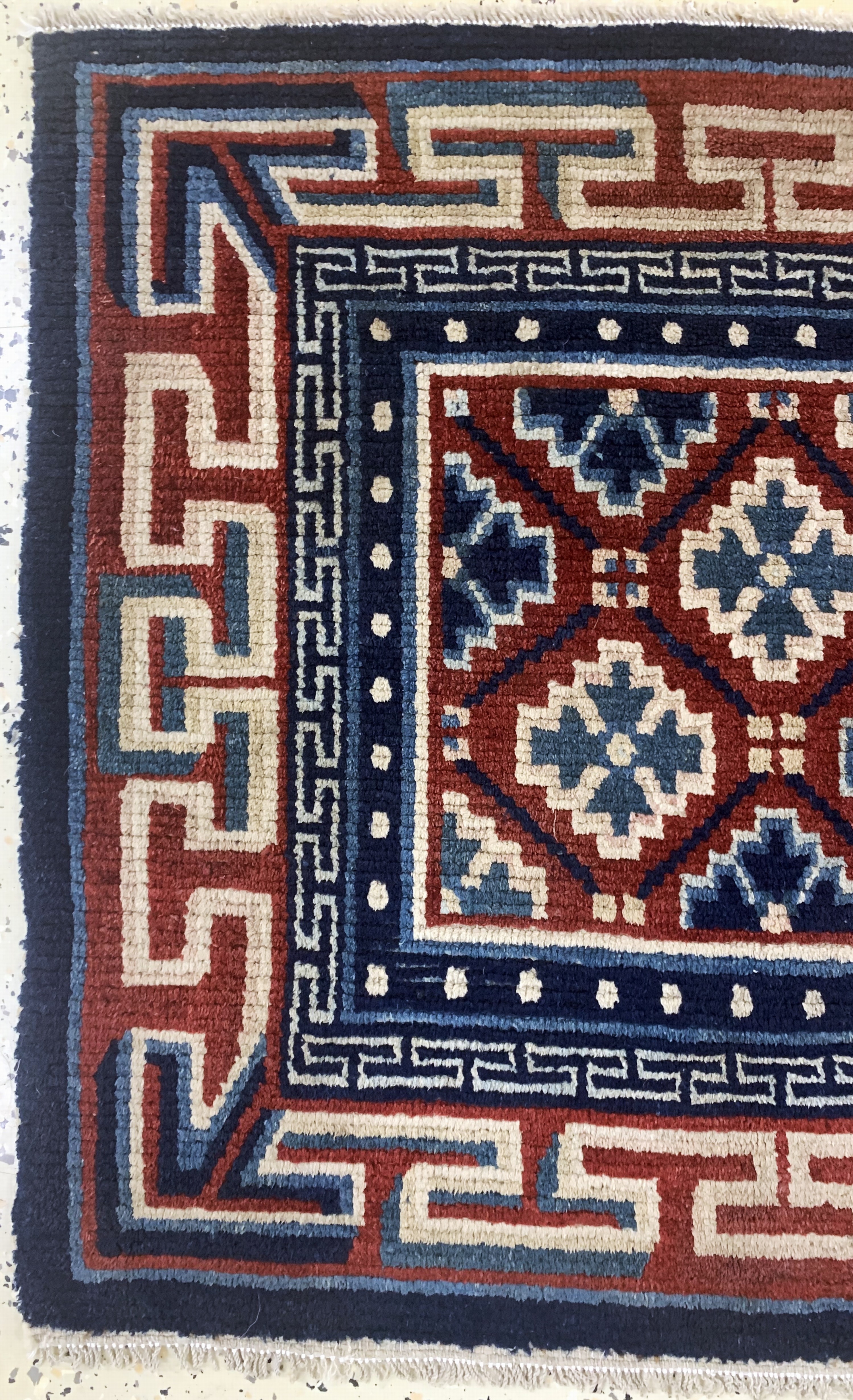 Detail b: Gyantse"Sitzmatte"alt, Tibet, um 1920, Wolle auf Wolle, ca. 70 x 78 cm, EHZ: 2