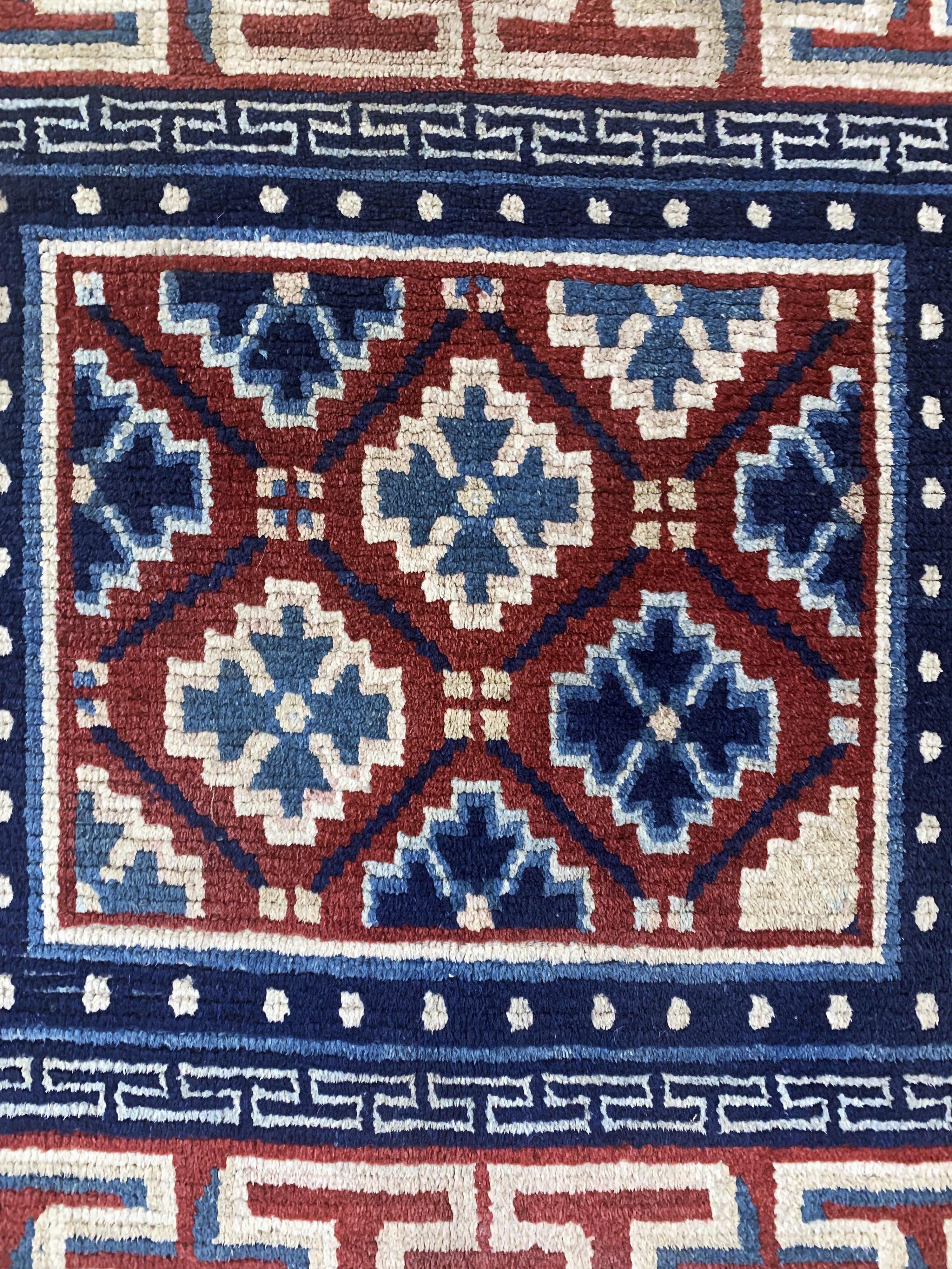 Detail c: Gyantse"Sitzmatte"alt, Tibet, um 1920, Wolle auf Wolle, ca. 70 x 78 cm, EHZ: 2