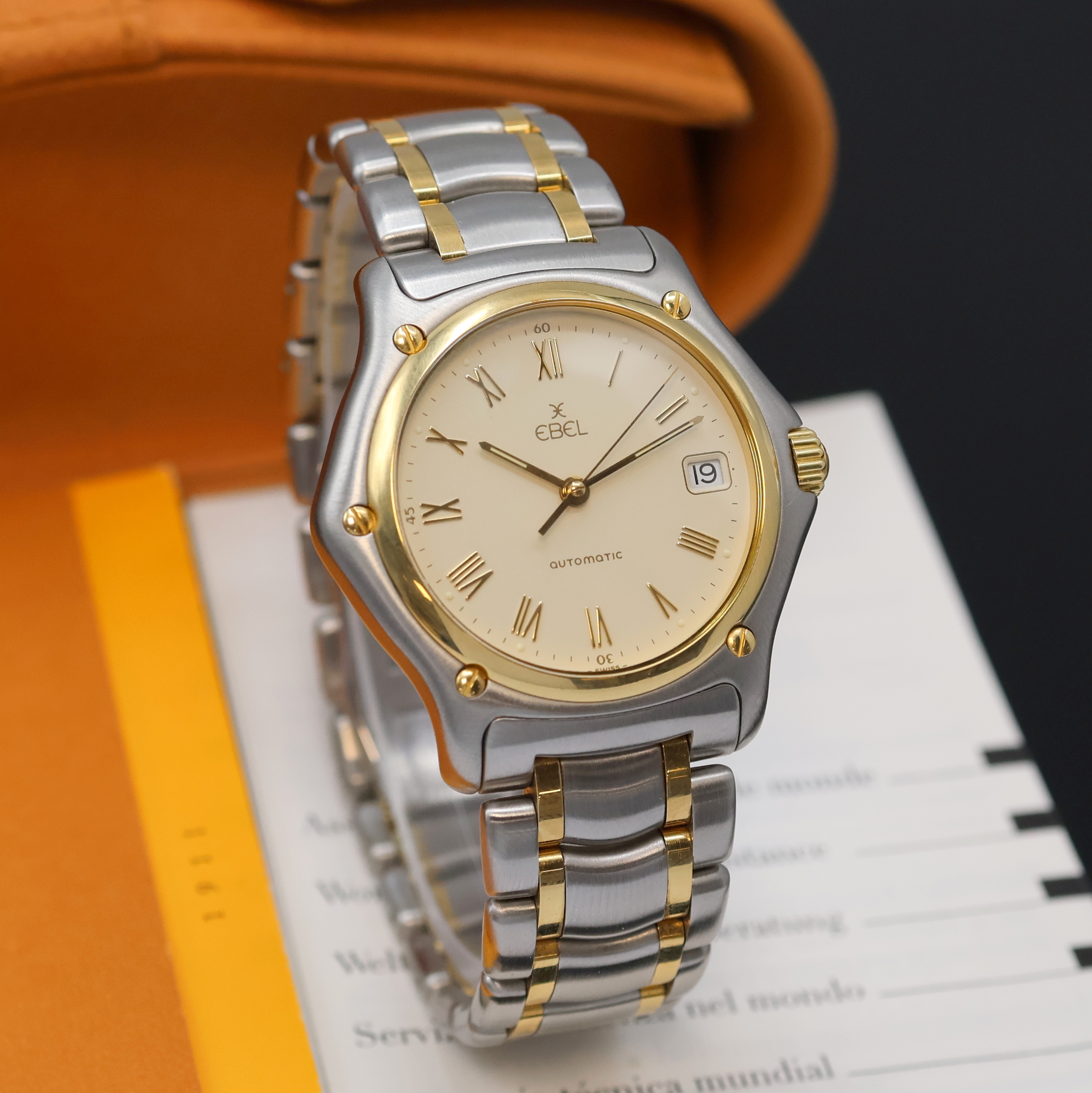 Detail b: EBEL 1911 Herrenarmbanduhr Referenz 1080916, Schweiz um 2005, Automatik, Edelstahl/Gold komb., Gliederband m. dopp. Faltschl., elfenbeinfarb. ...