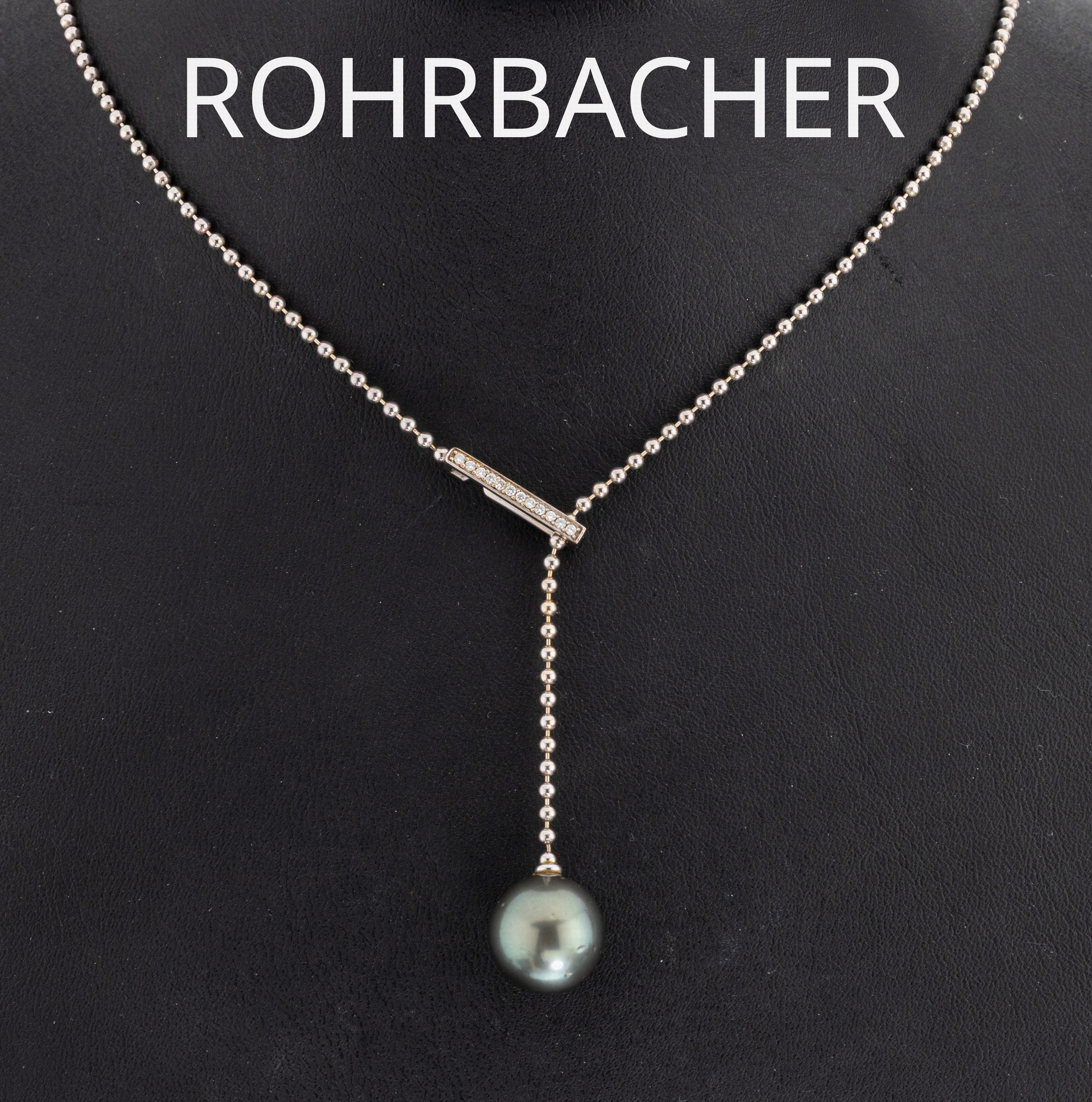 18 kt Gold Perl-Brillant-Collier, WG 750/000, sogn. Y-Collier, Kugelkette, Tahitizuchtperle, D. ca. 12 mm, Schieber mit 12 Brillanten zus. ca. 0.06 ...
