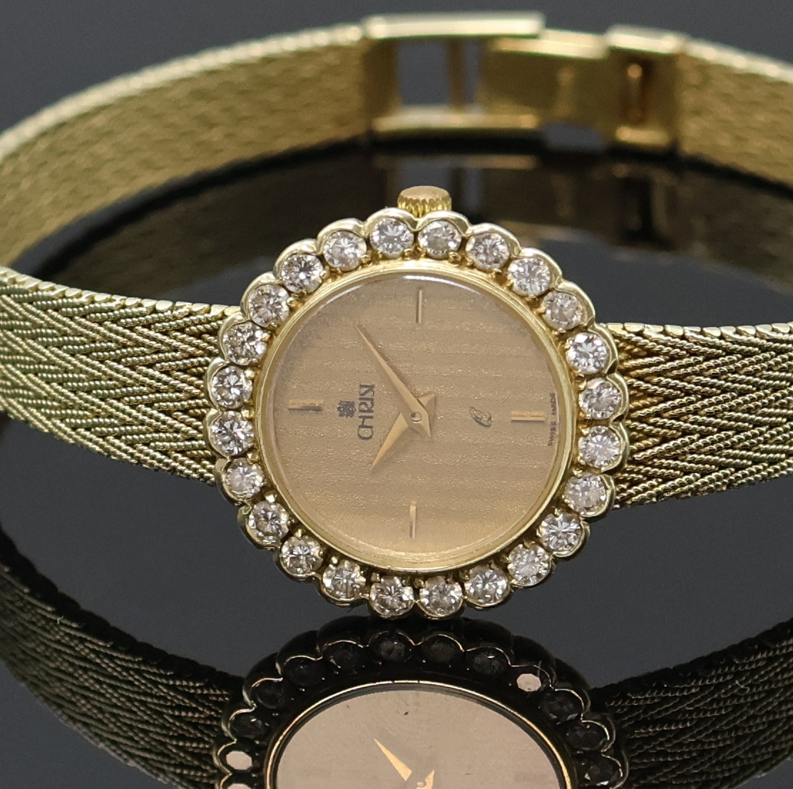 Detail a: CHRIST Damenarmbanduhr in GG 585/000 mit Diamanten, Schweiz um 1975, quarz, Goldband, Boden aufgedr., Lünette aufw. m. Diamanten bes., goldfarb. ...