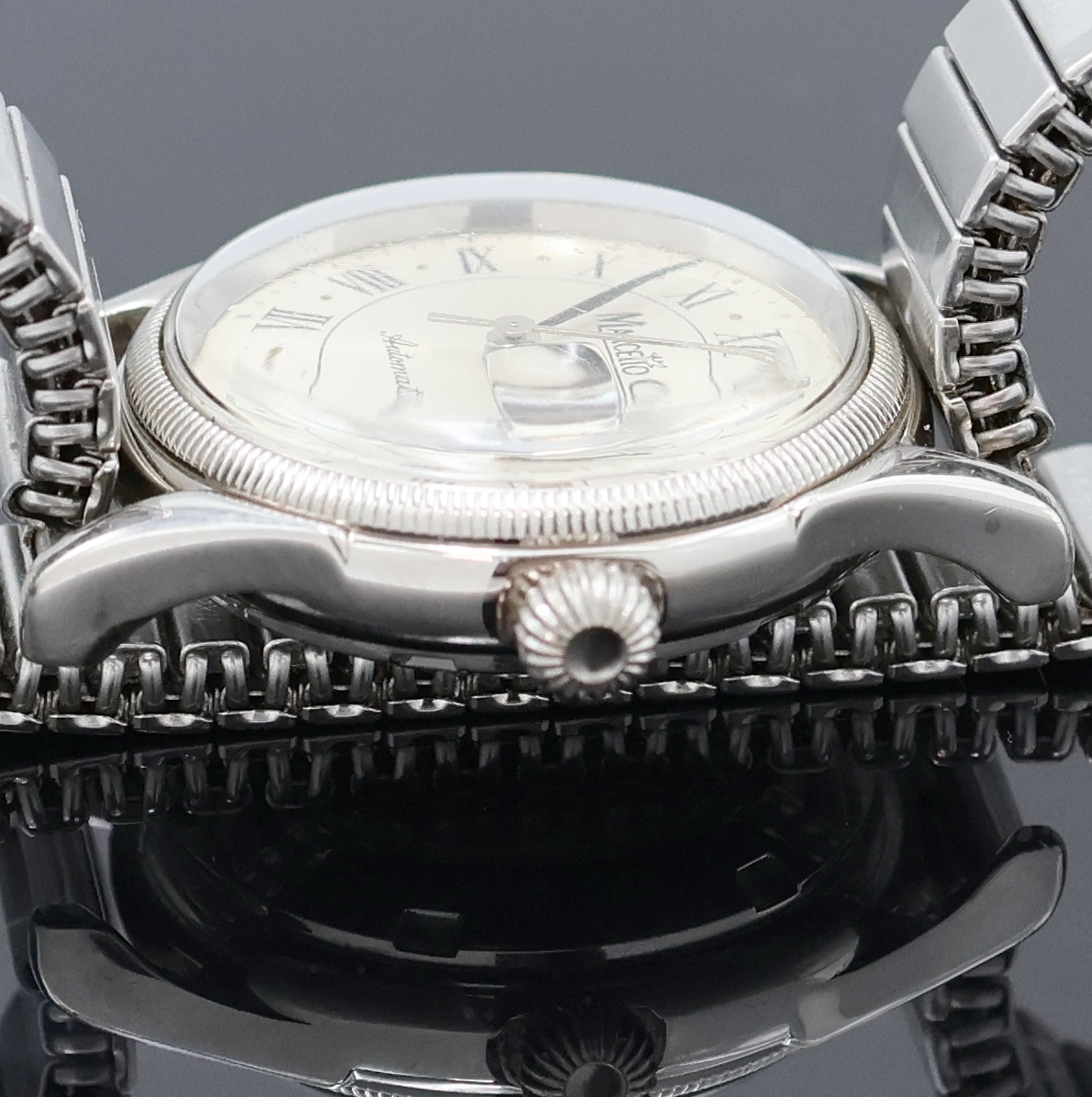 Detail d: MARCELLO C Armbanduhr in Stahl, Schweiz um 2000, Automatik, beids. vergl. Geh., Boden verschr., neutr. Flexband, silb. Zifferbl. m. röm. Zahlen, ...