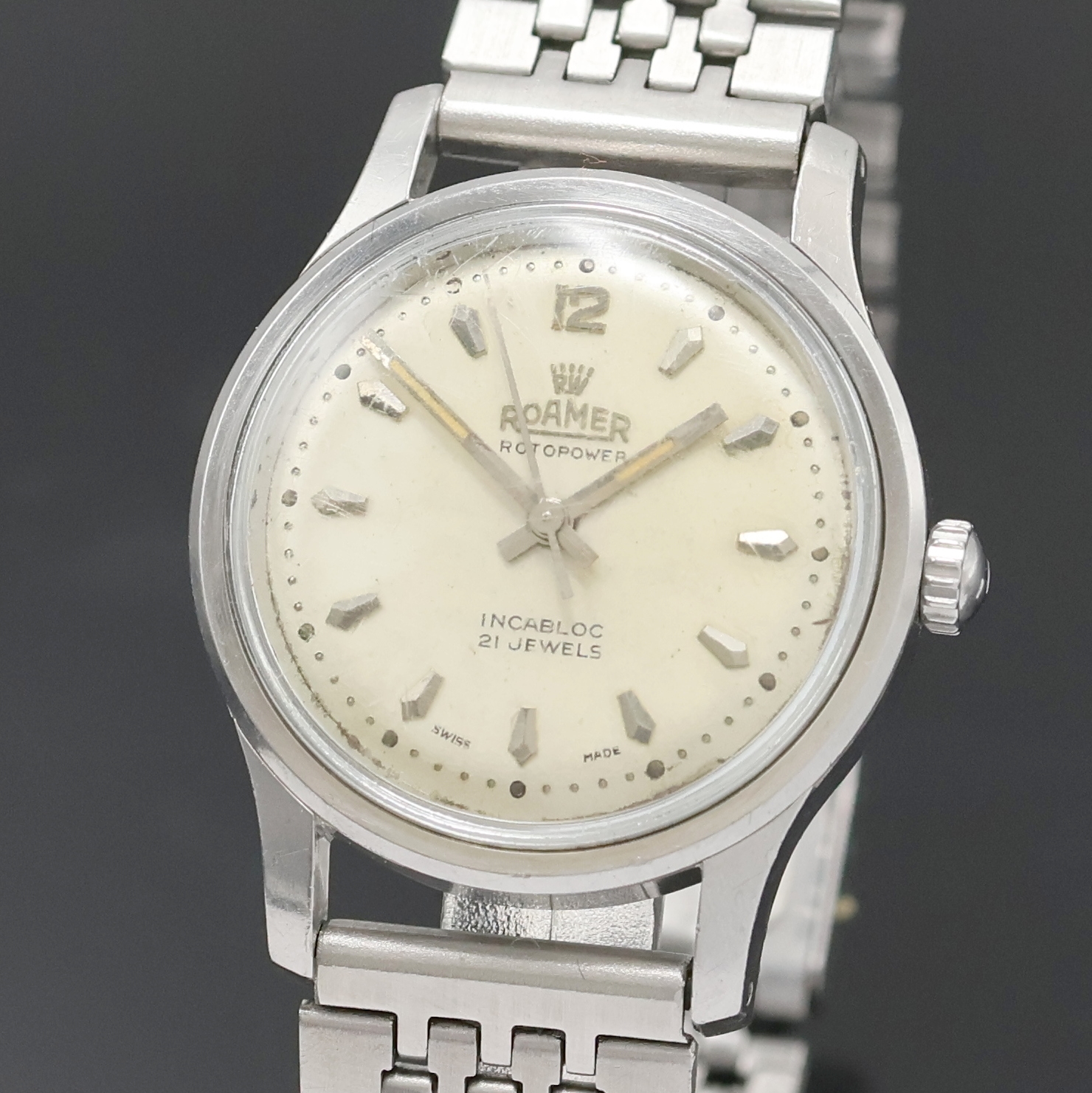 Detail a: ROAMER Rotopower Armbanduhr in Stahl Referenz 180459, Schweiz um 1960, Automatik, Boden aufgedr., Reiskornband m. Faltschl., silb. Zifferbl. pat., ...