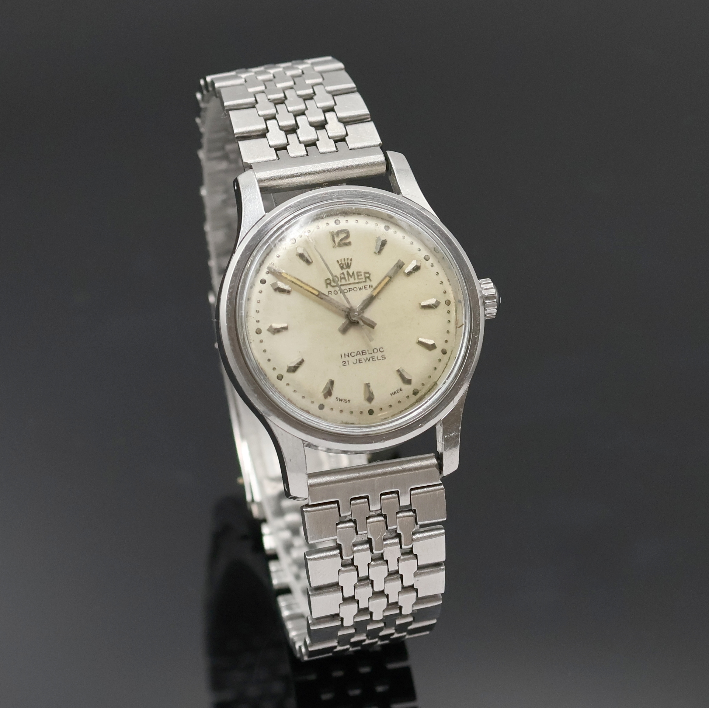 Detail b: ROAMER Rotopower Armbanduhr in Stahl Referenz 180459, Schweiz um 1960, Automatik, Boden aufgedr., Reiskornband m. Faltschl., silb. Zifferbl. pat., ...