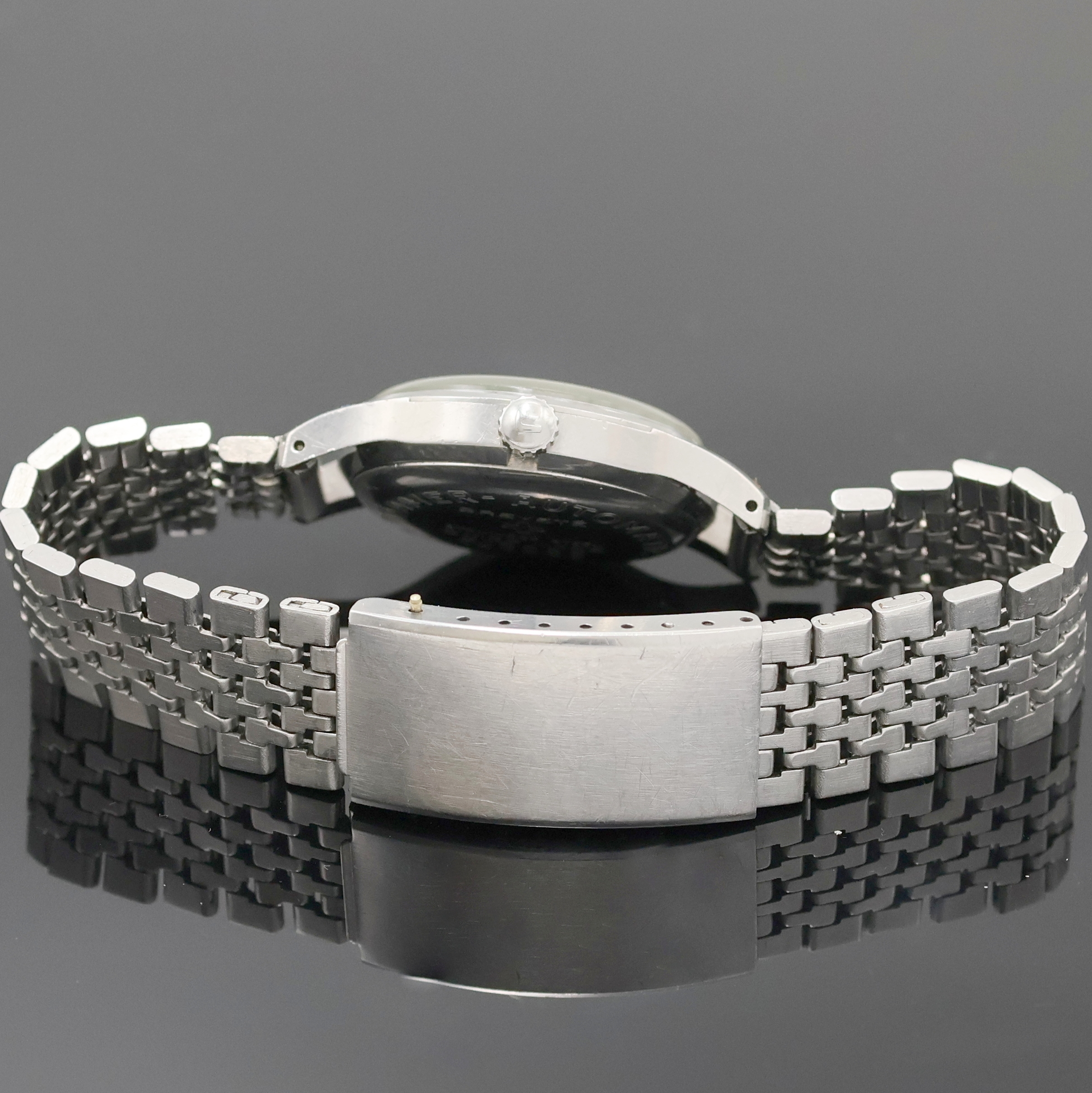 Detail c: ROAMER Rotopower Armbanduhr in Stahl Referenz 180459, Schweiz um 1960, Automatik, Boden aufgedr., Reiskornband m. Faltschl., silb. Zifferbl. pat., ...
