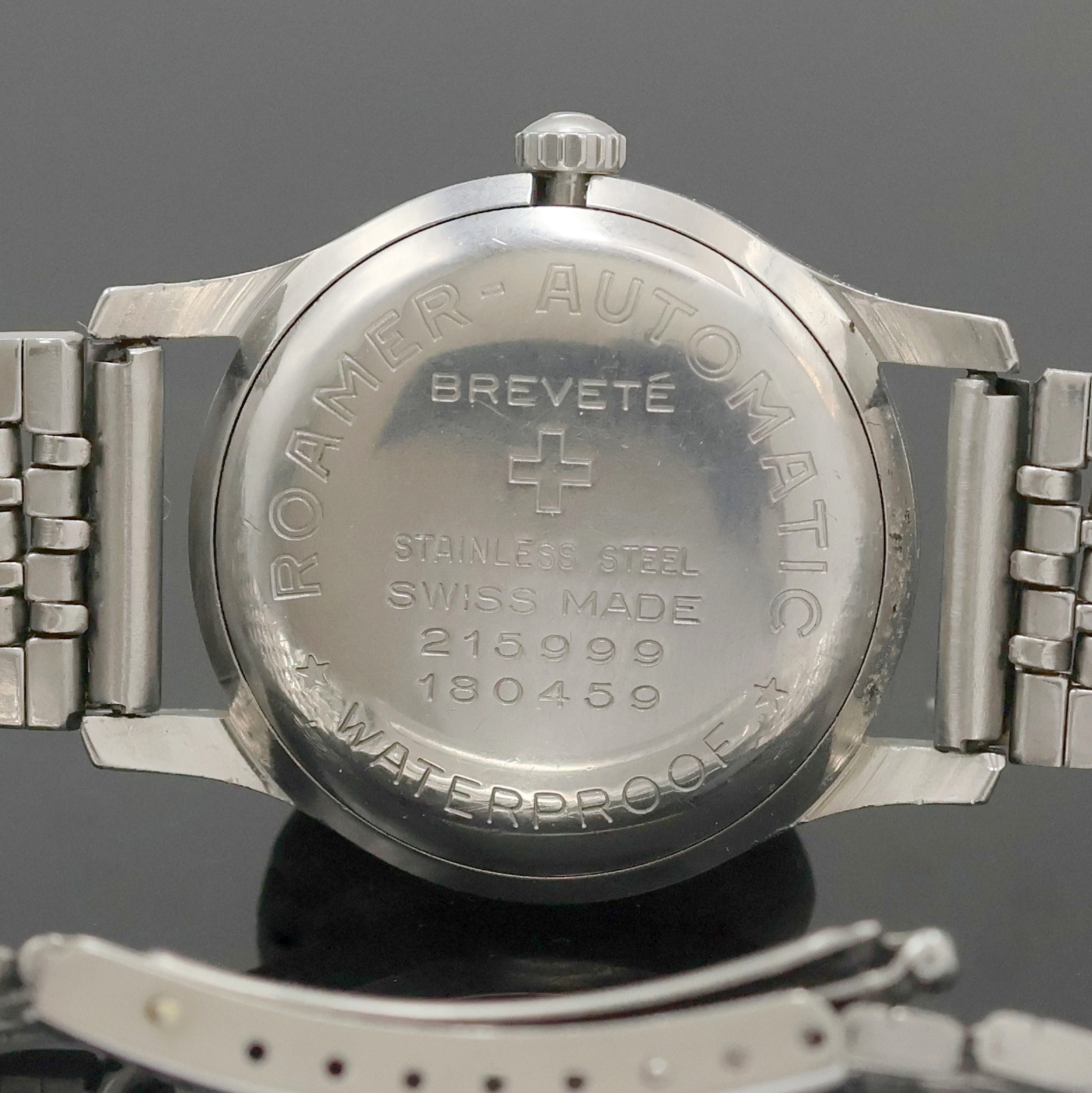Detail e: ROAMER Rotopower Armbanduhr in Stahl Referenz 180459, Schweiz um 1960, Automatik, Boden aufgedr., Reiskornband m. Faltschl., silb. Zifferbl. pat., ...