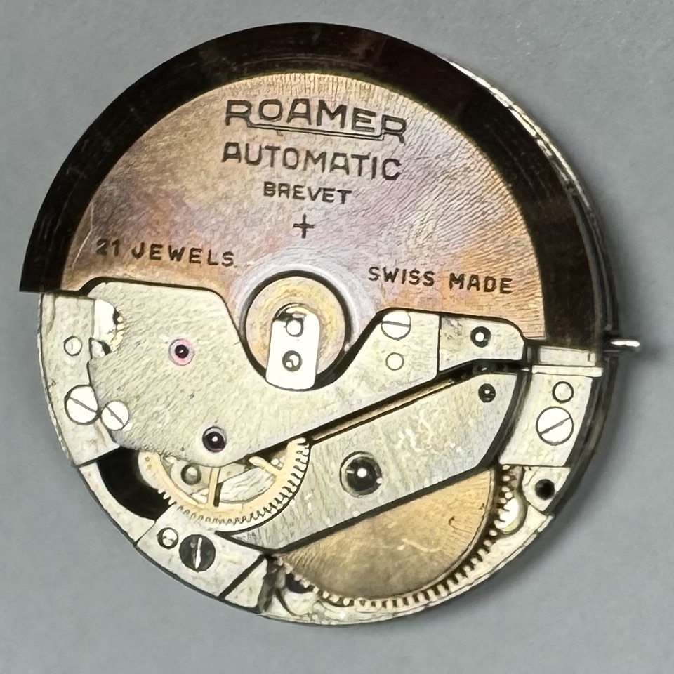 Detail f: ROAMER Rotopower Armbanduhr in Stahl Referenz 180459, Schweiz um 1960, Automatik, Boden aufgedr., Reiskornband m. Faltschl., silb. Zifferbl. pat., ...