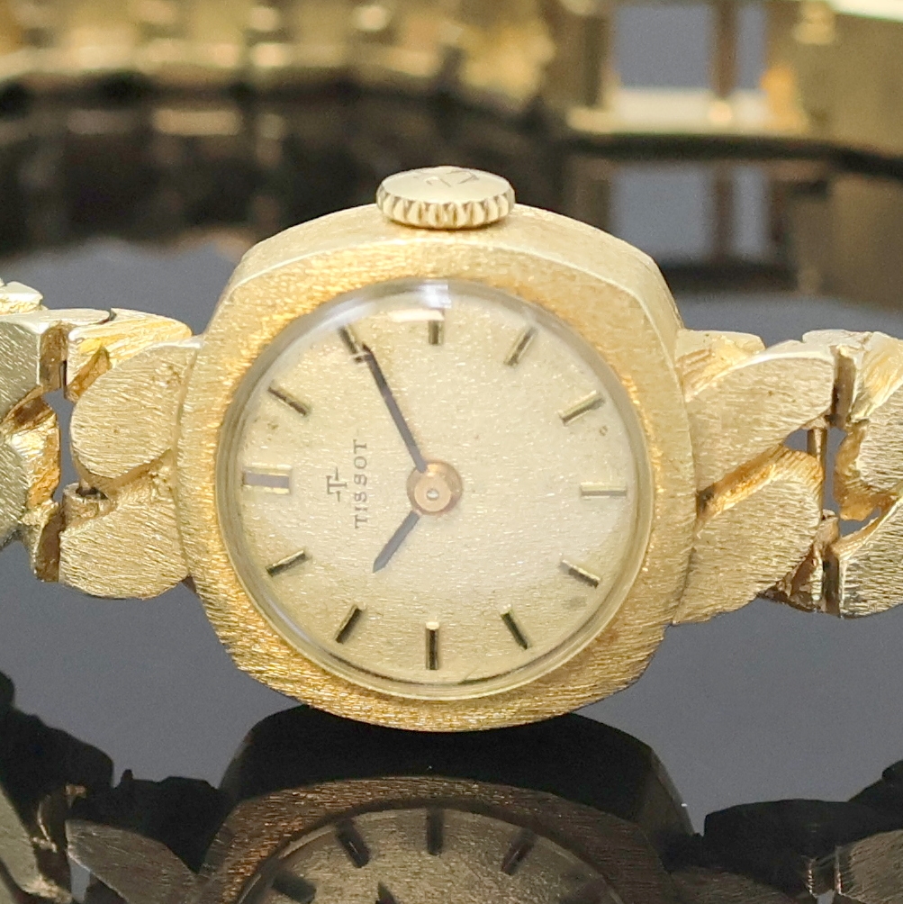 Detail a: TISSOT Damenarmbanduhr in GG 585/000, Schweiz um 1970, Handaufzug, 2-teil. viereckiges Geh. m. angesetzt. Gold- Gliederband m. Klappschl., gold. ...